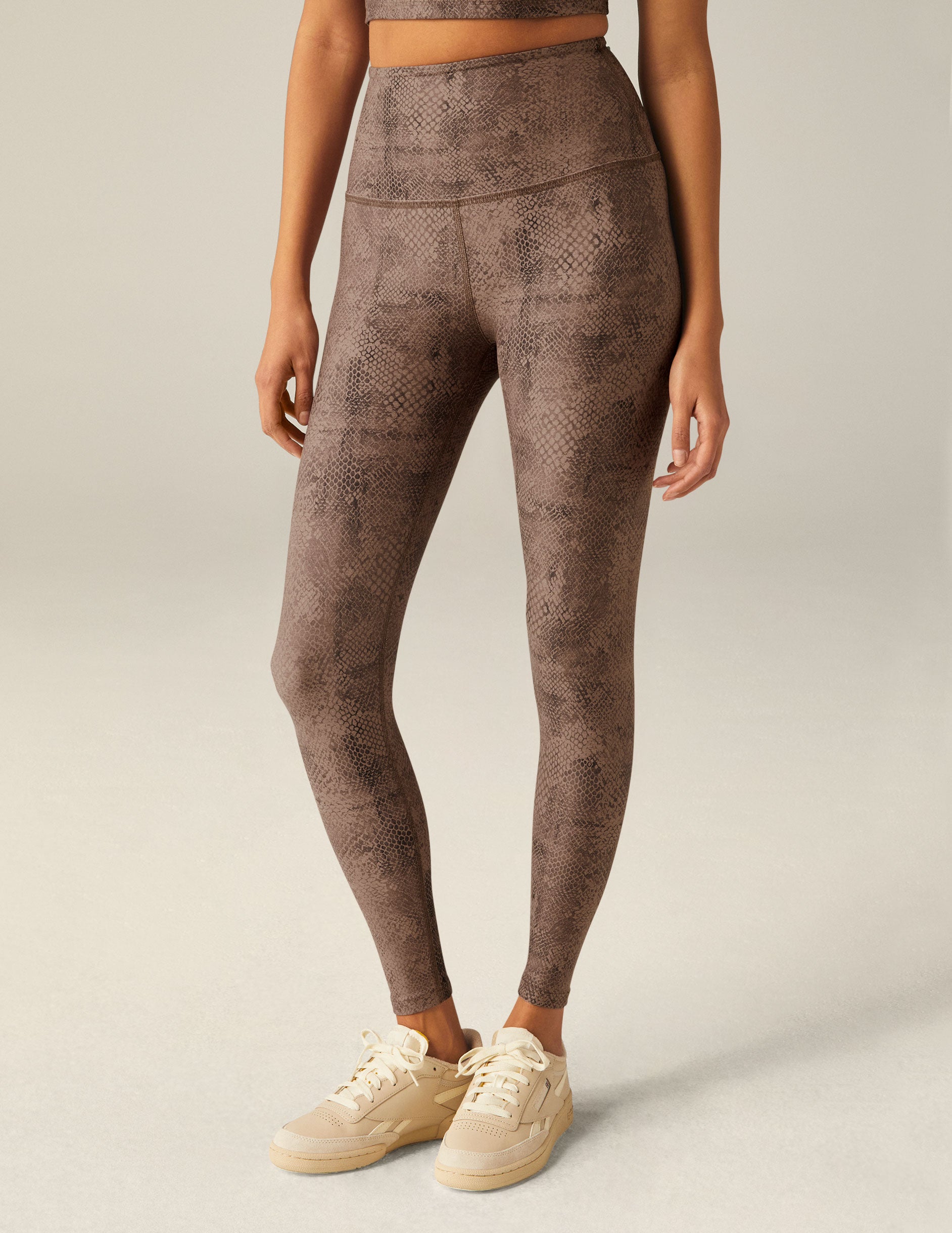 brown faux snakeskin printed high-waisted midi leggings.