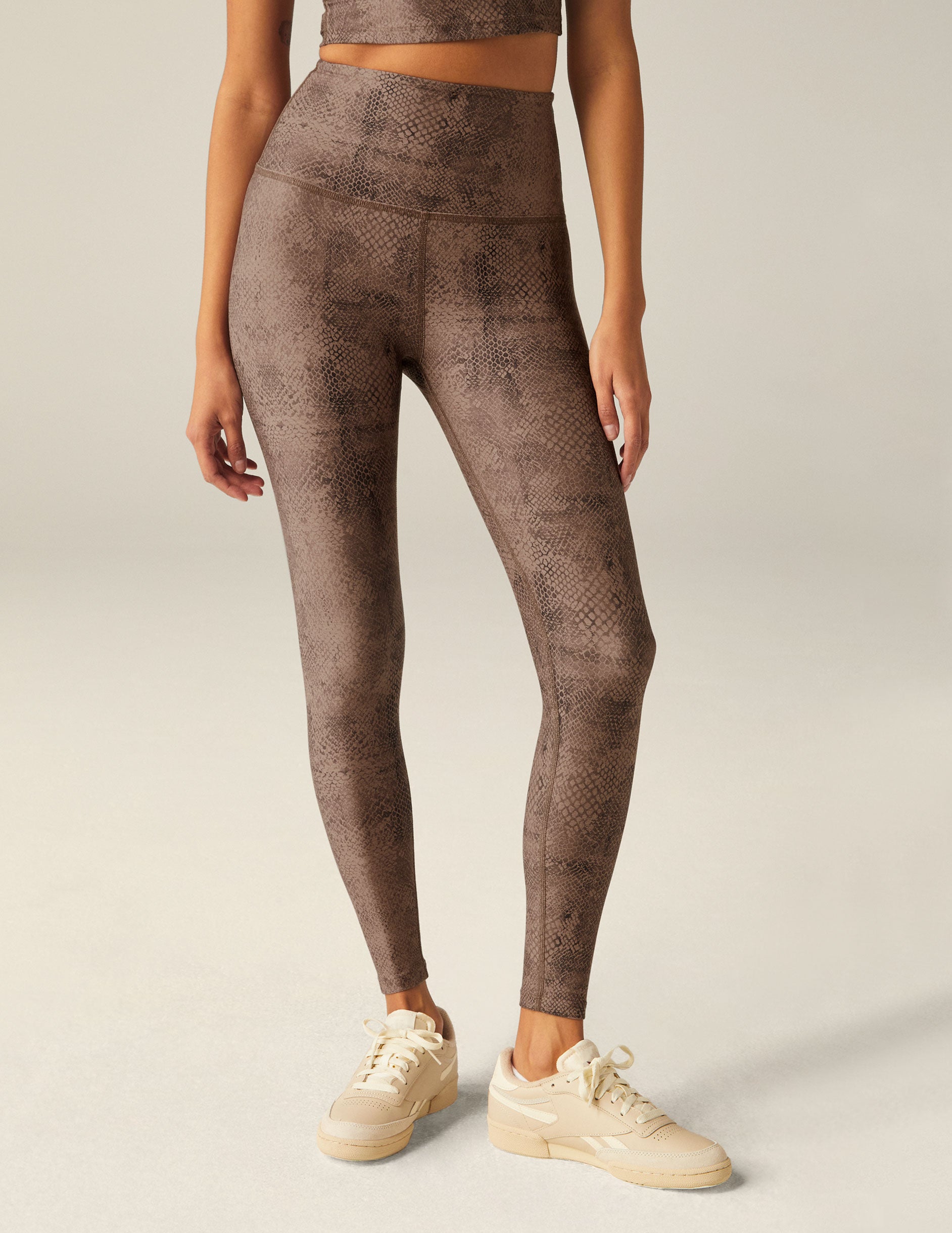 brown faux snakeskin printed high-waisted midi leggings.