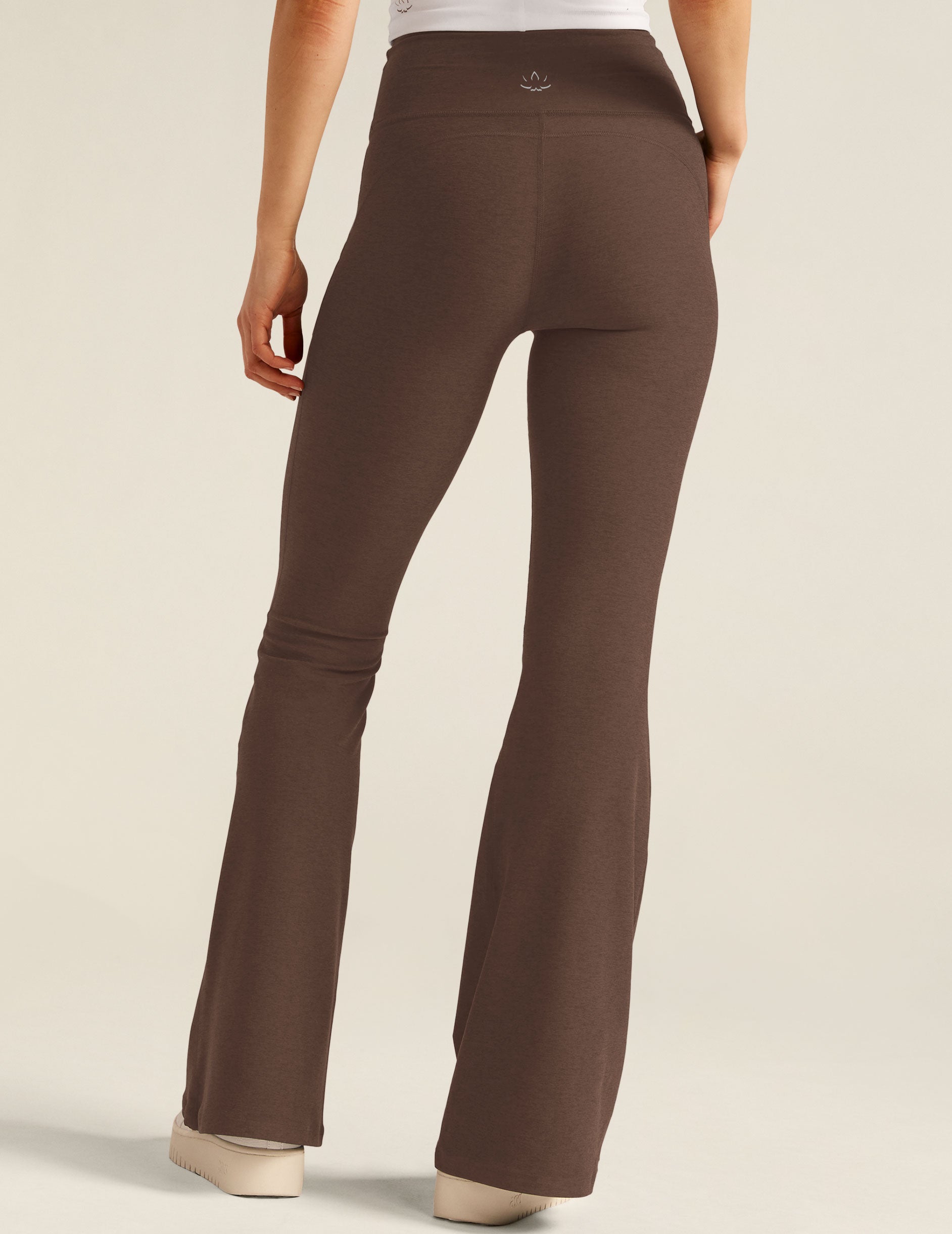 brown high-waisted flare pants with front side pockets. 