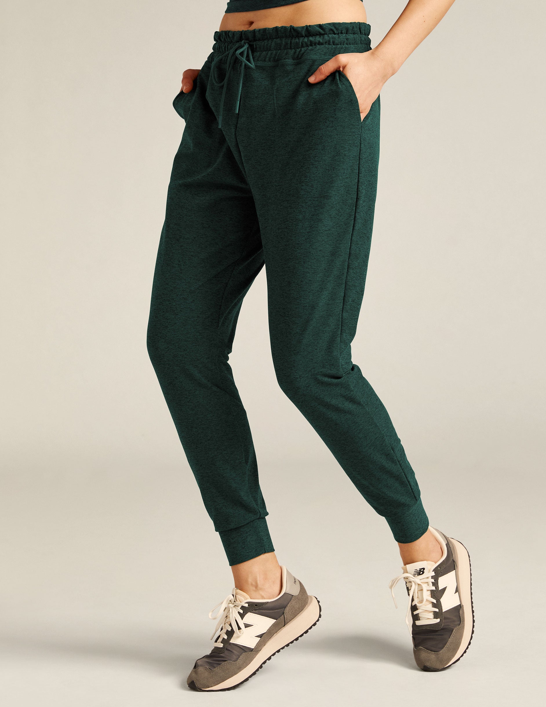 green midi pocket joggers with an elastic waistband and drawstring.