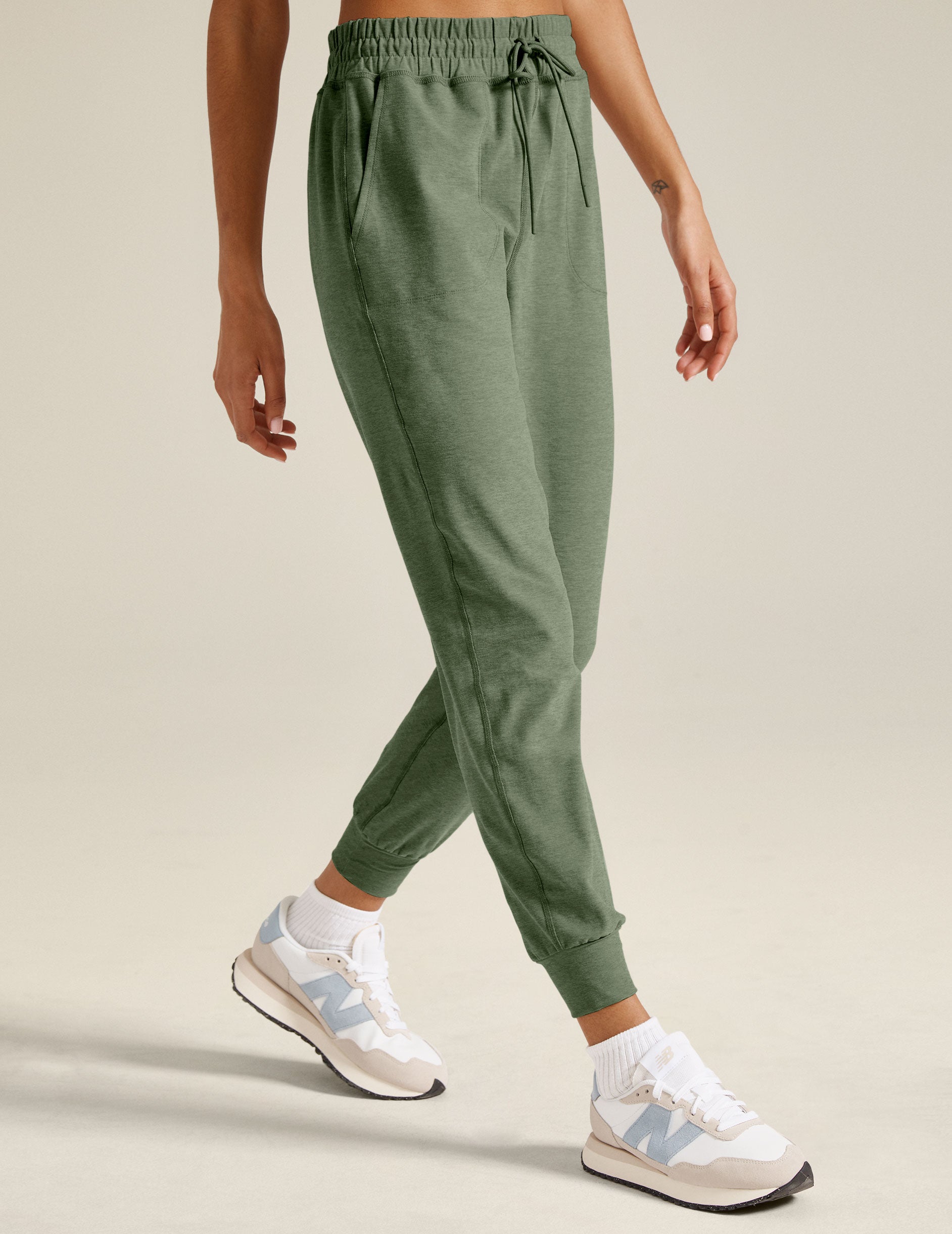 green midi jogger pants with a drawstring at waistband.