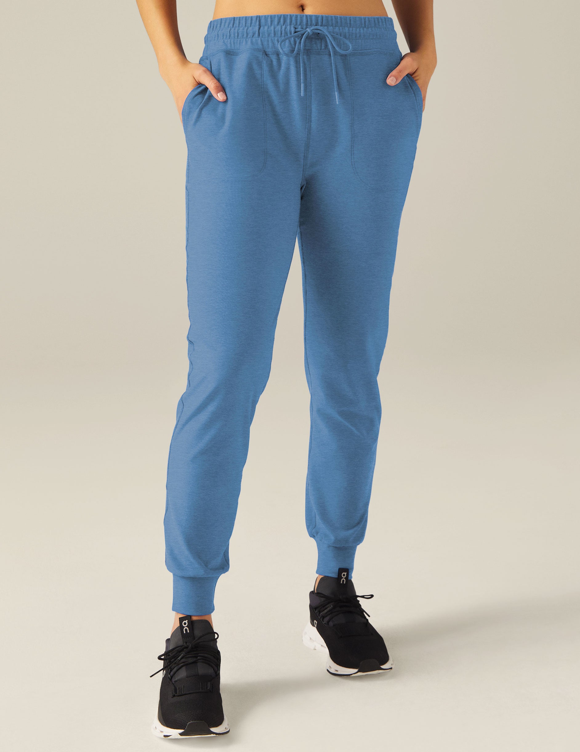 blue jogger pants with a drawstring at waistband. 