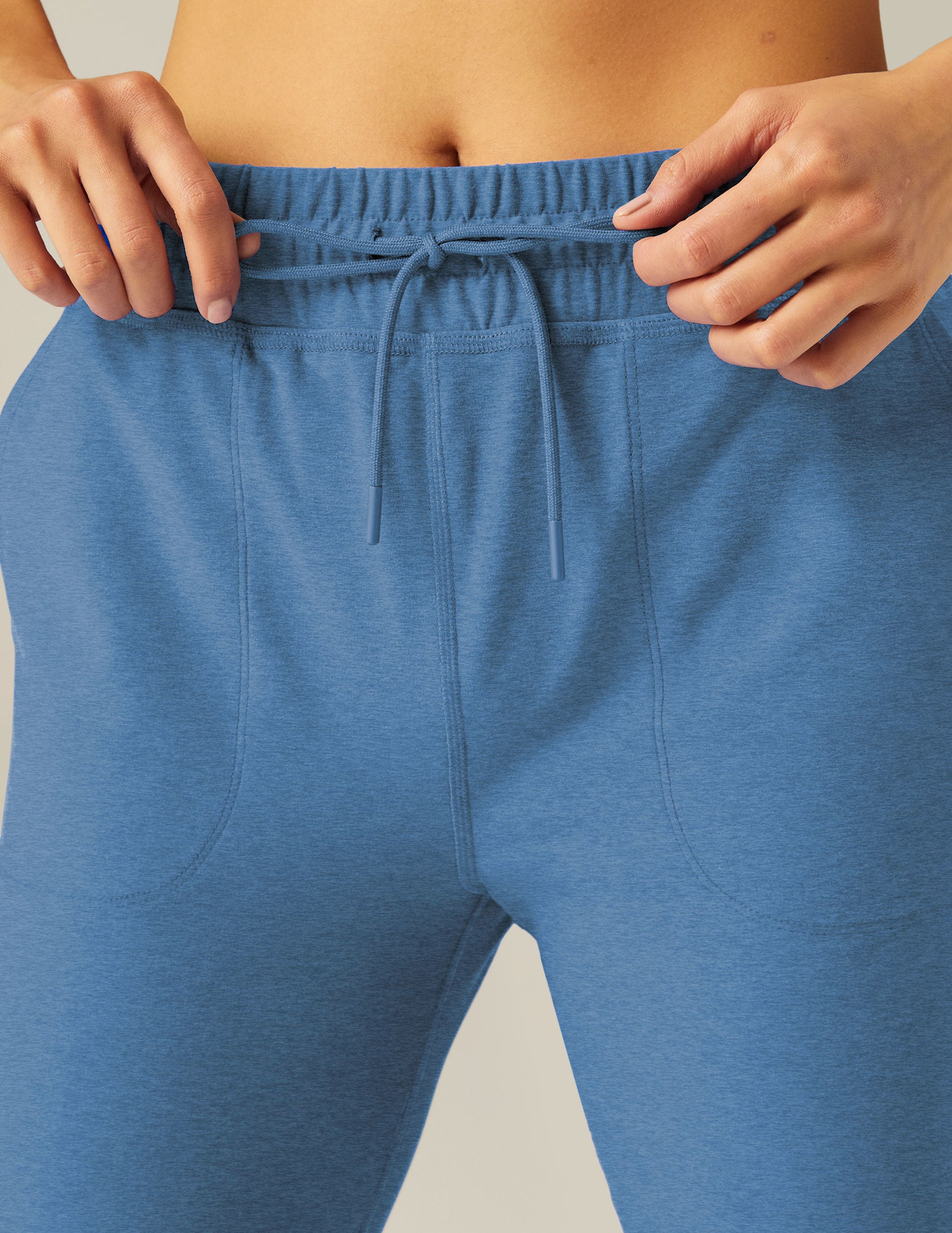 blue jogger pants with a drawstring at waistband. 