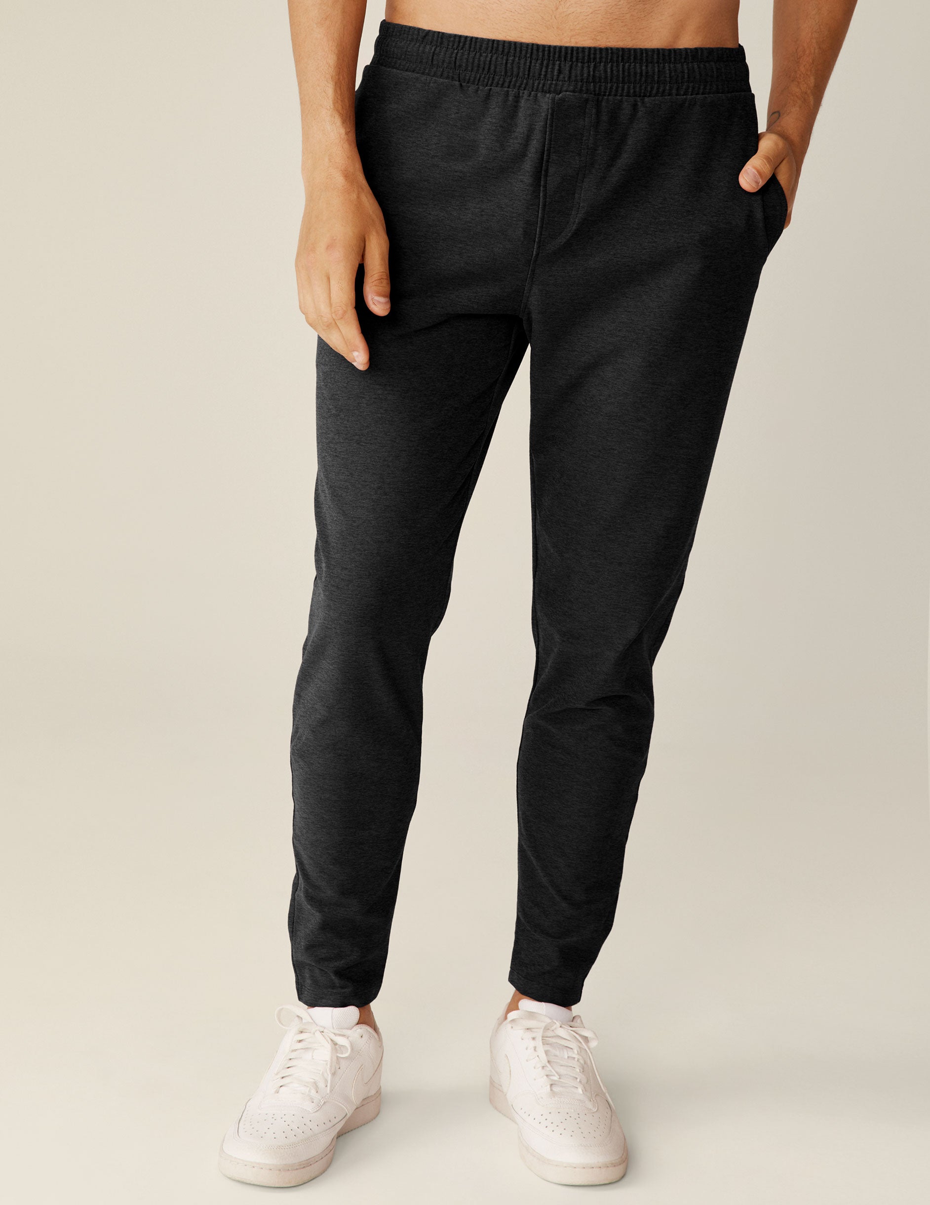 black men's athleisure pants with an internal drawcord and pockets.