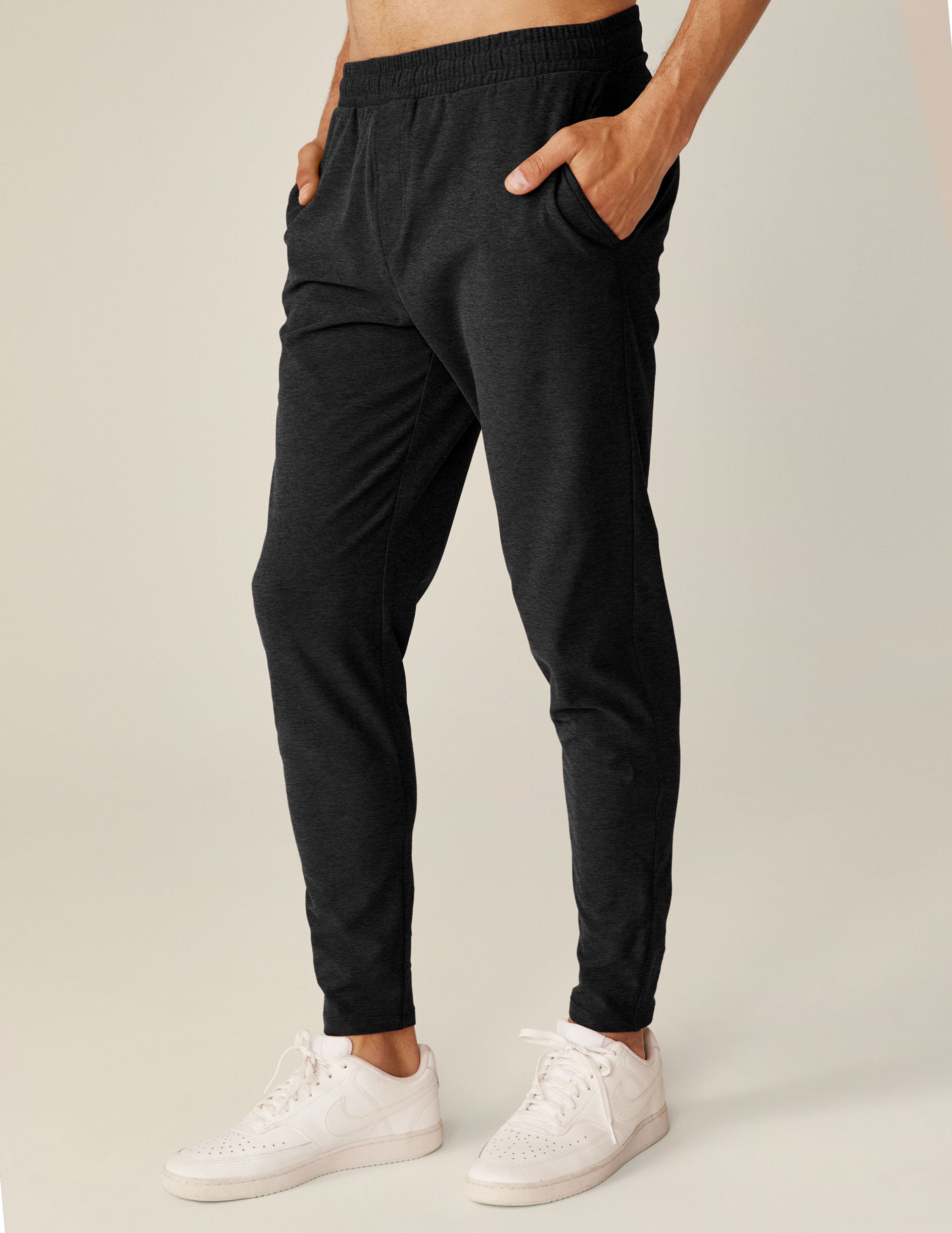 black men's athleisure pants with an internal drawcord and pockets.