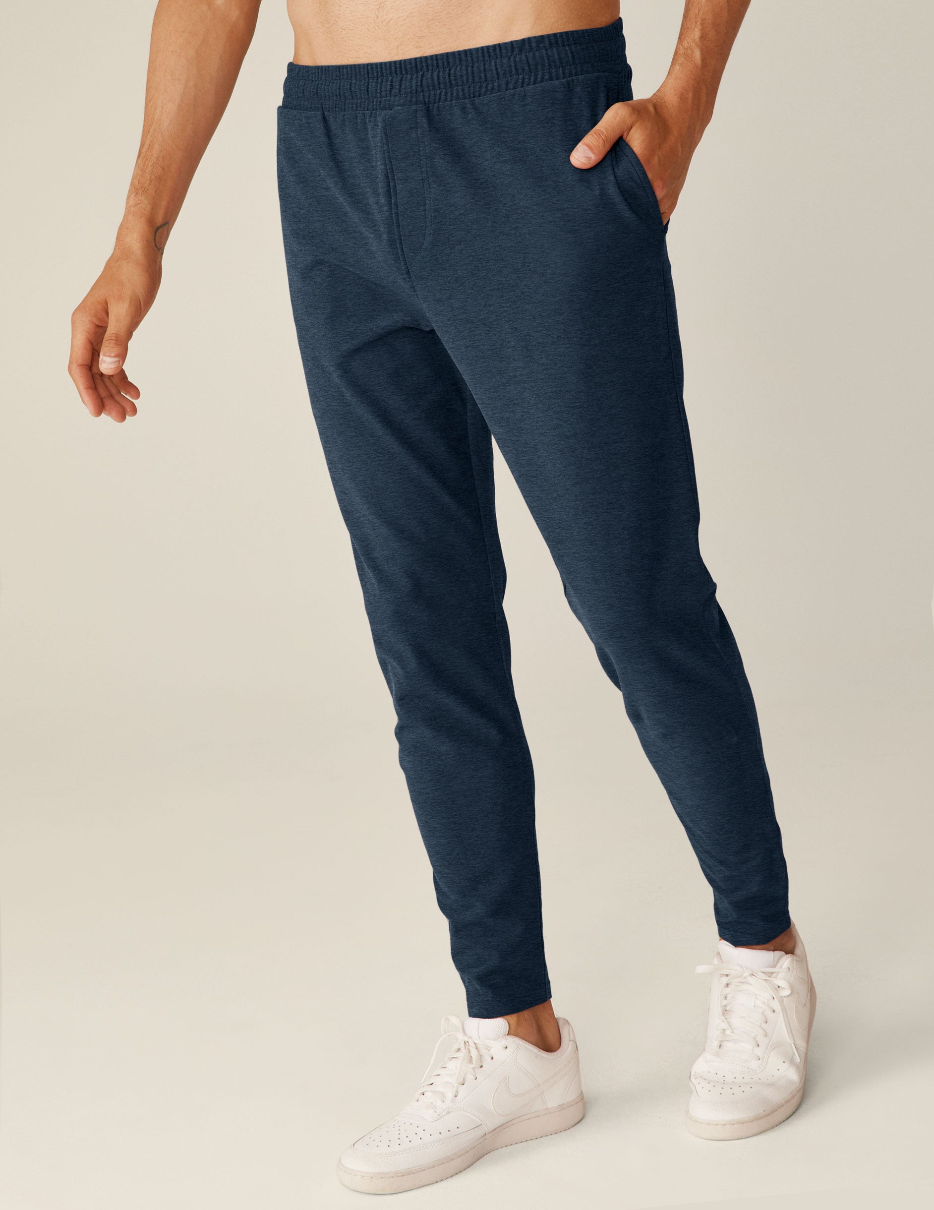 blue men's athleisure pants with an internal drawcord and pockets.