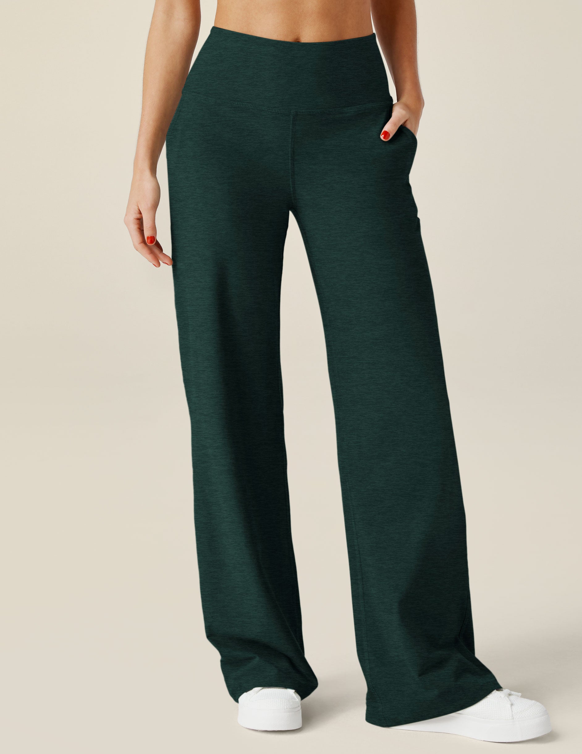 green high-waisted wide leg spacedye pants with pockets. 