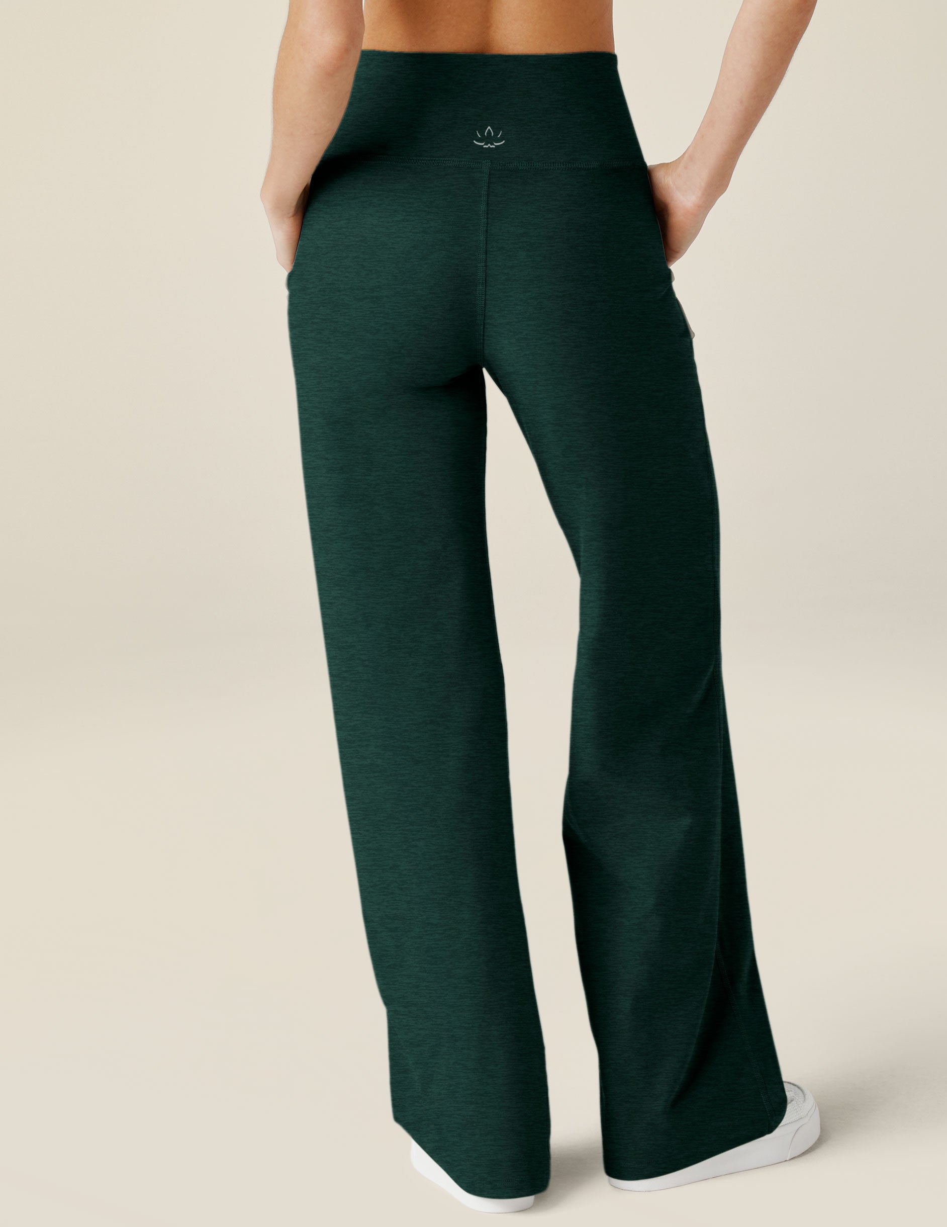 green high-waisted wide leg spacedye pants with pockets. 