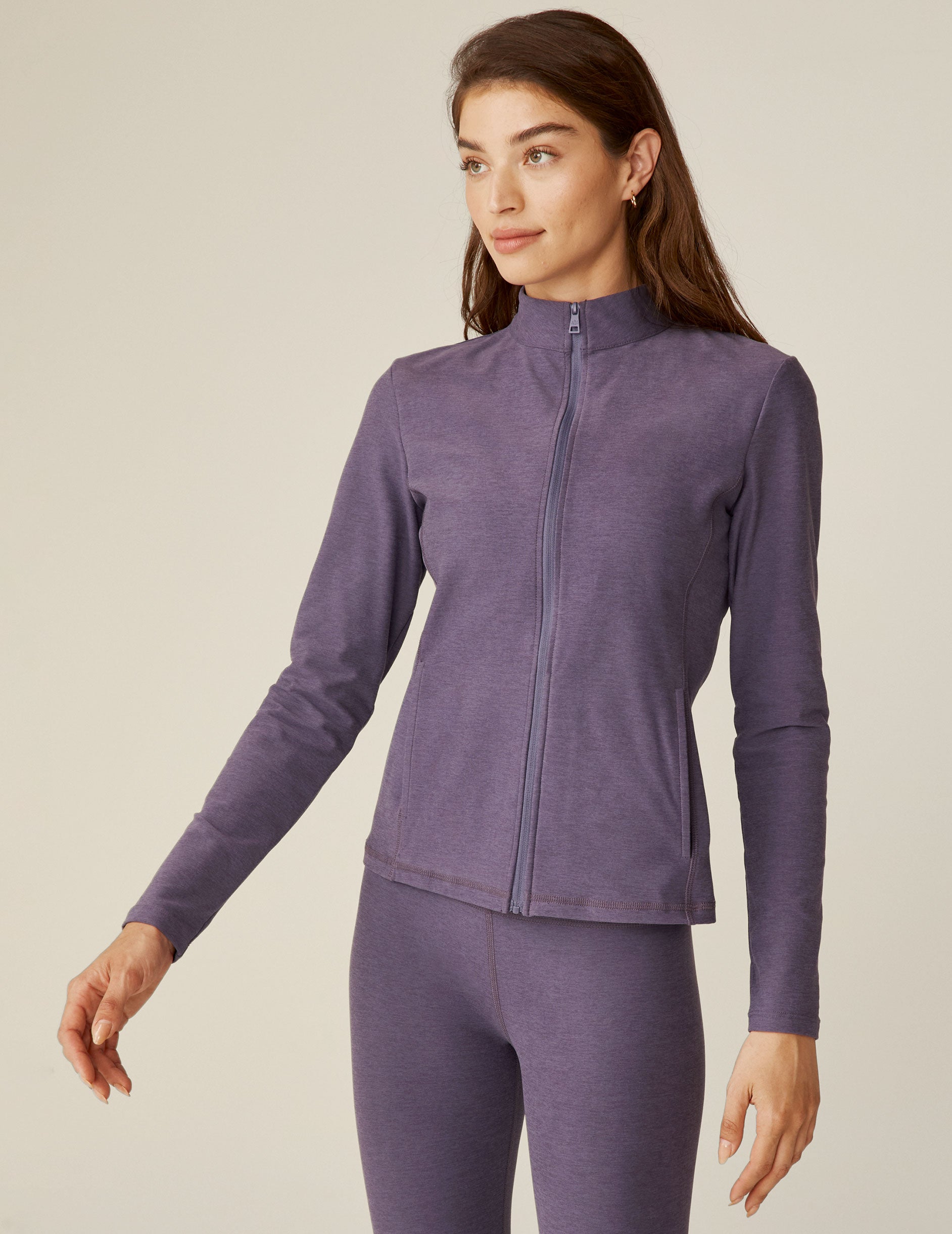 purple mock neck zip-up jacket with pockets. 