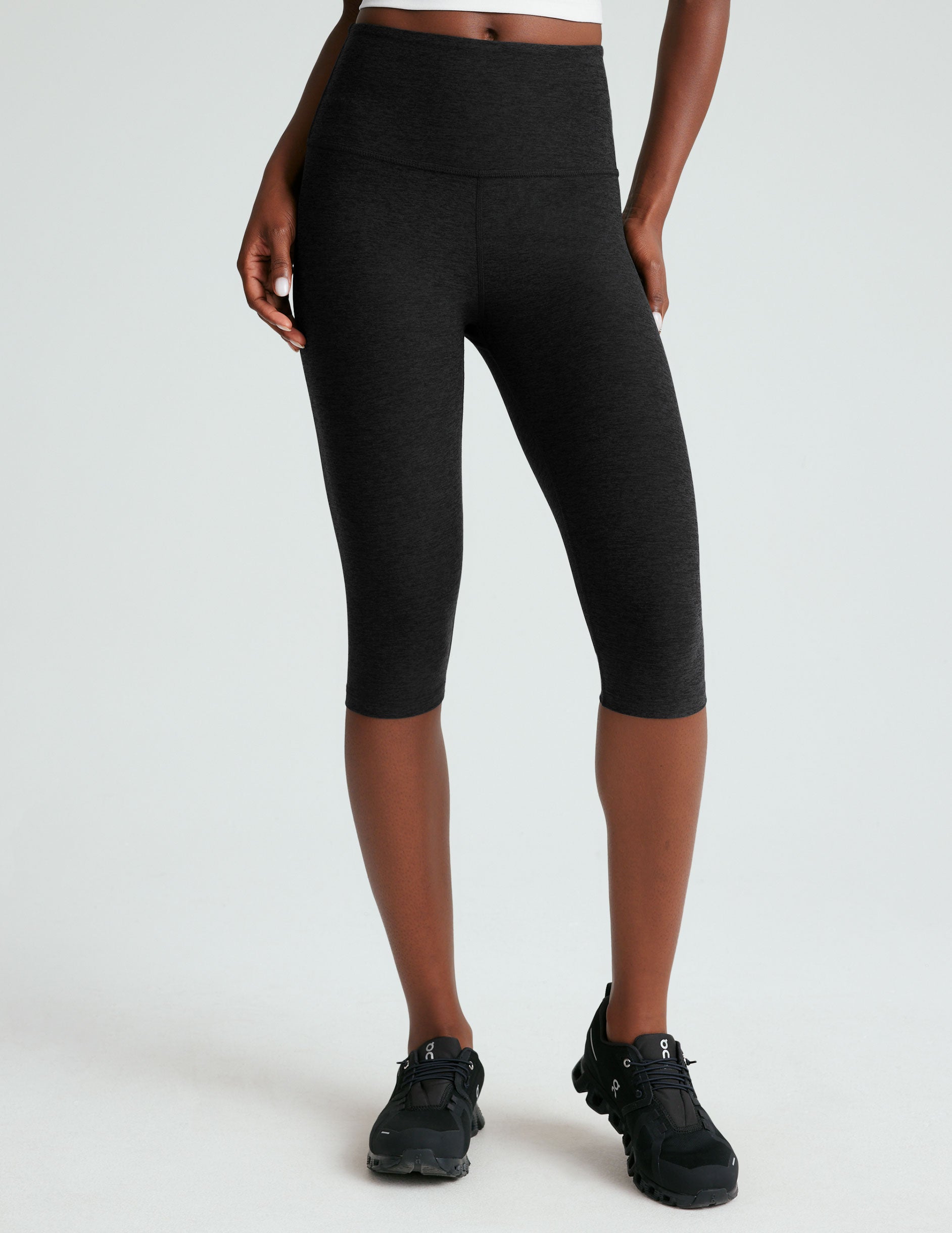 black high-waisted pedal pusher length legging.