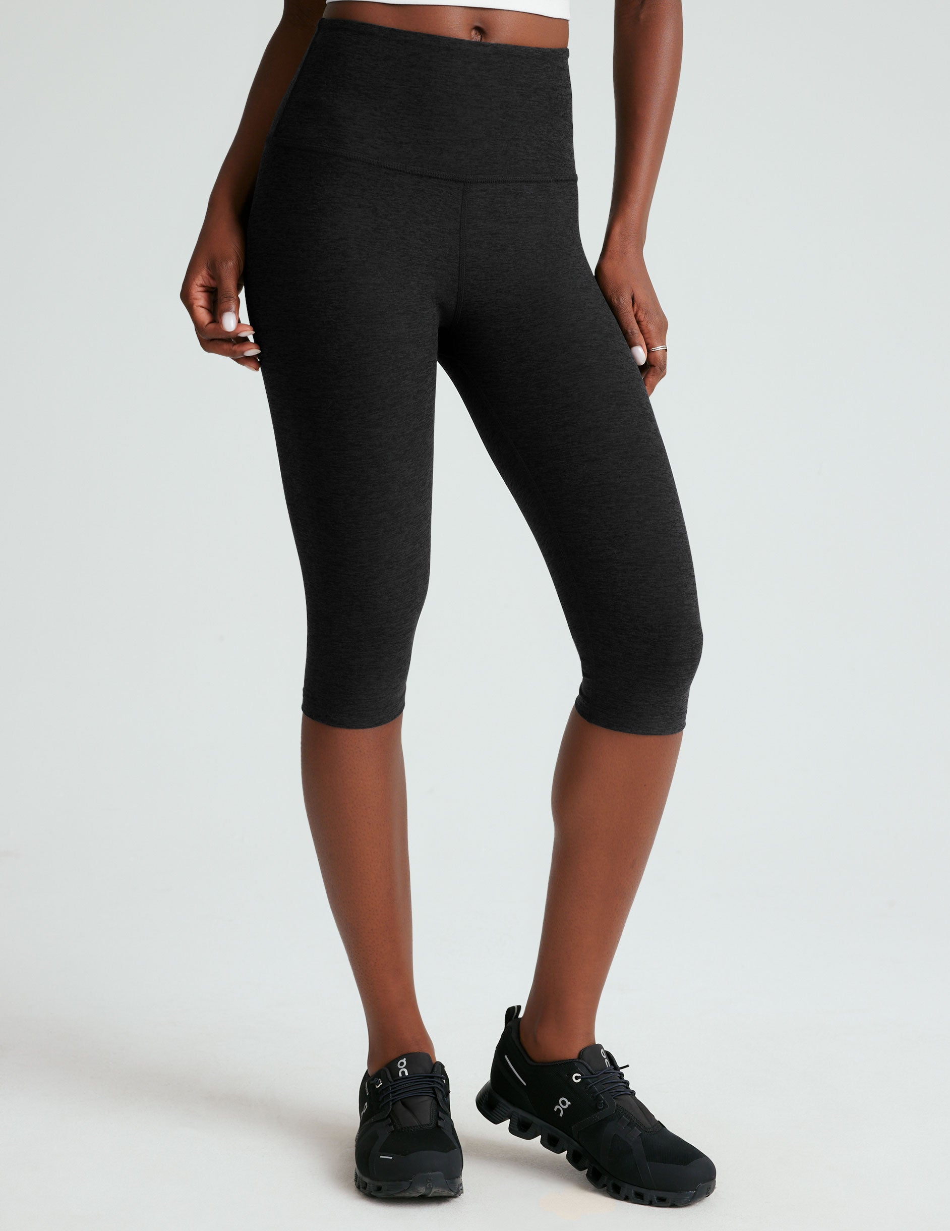 black high-waisted pedal pusher length legging.