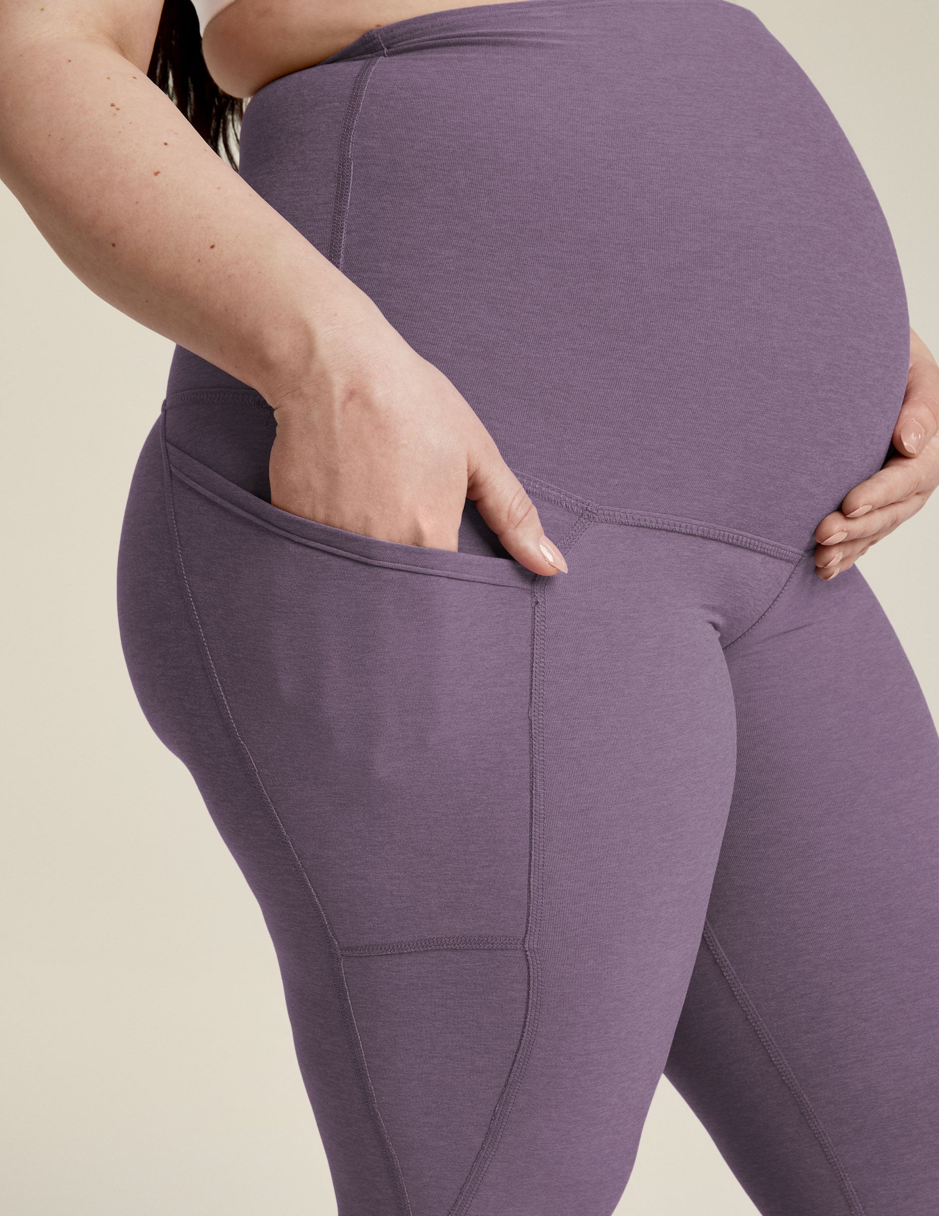 purple maternity midi leggings with side pockets.