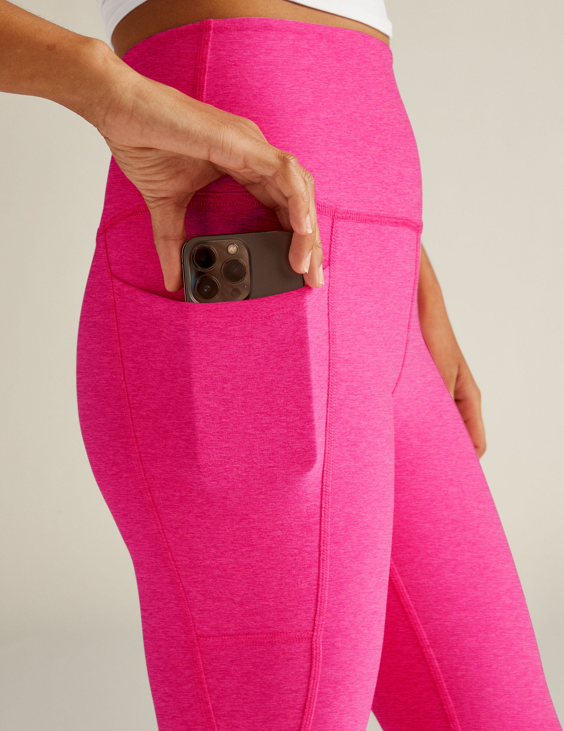 pink high-waisted midi pocket leggings. 
