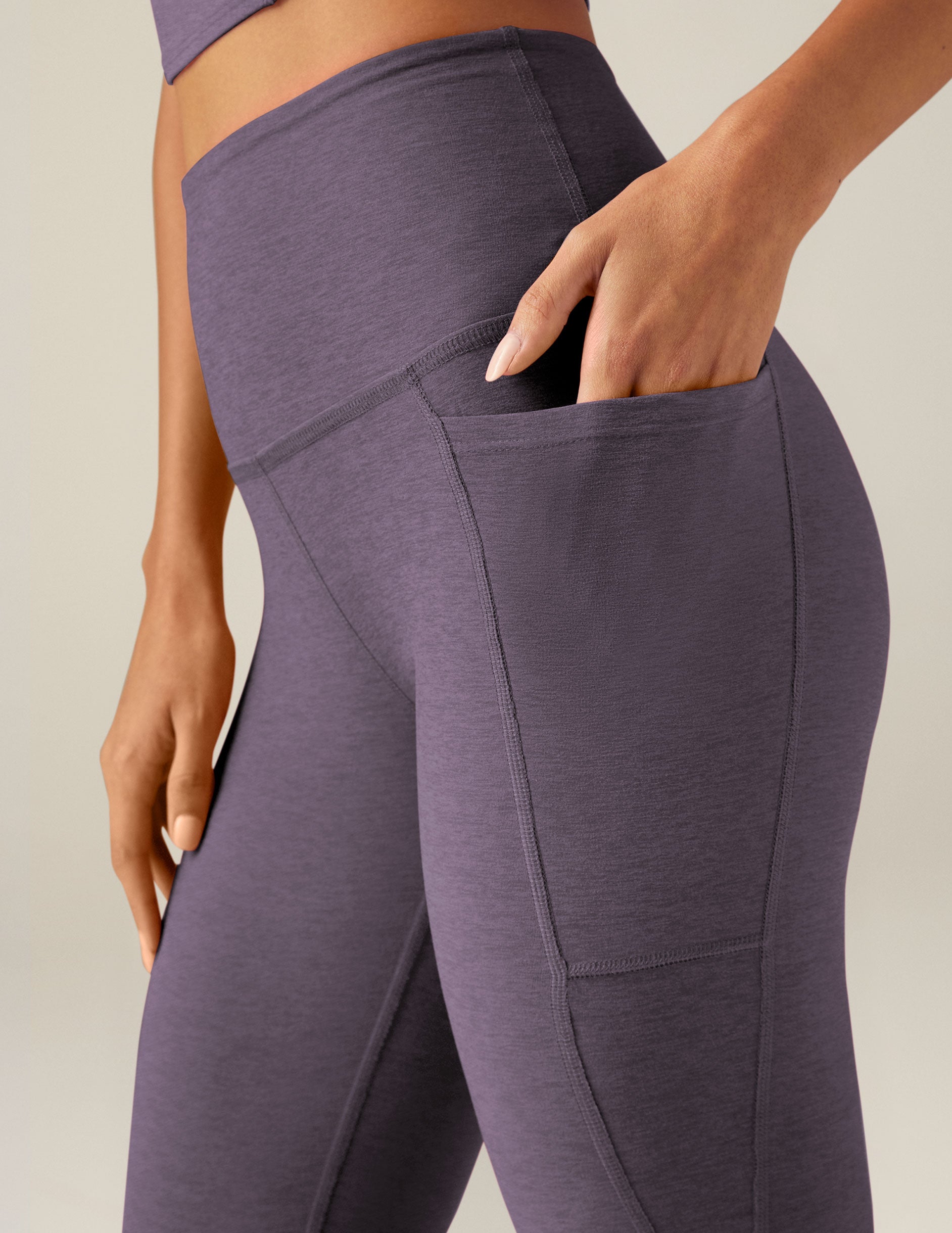 purple high-waisted midi leggings with pockets. 