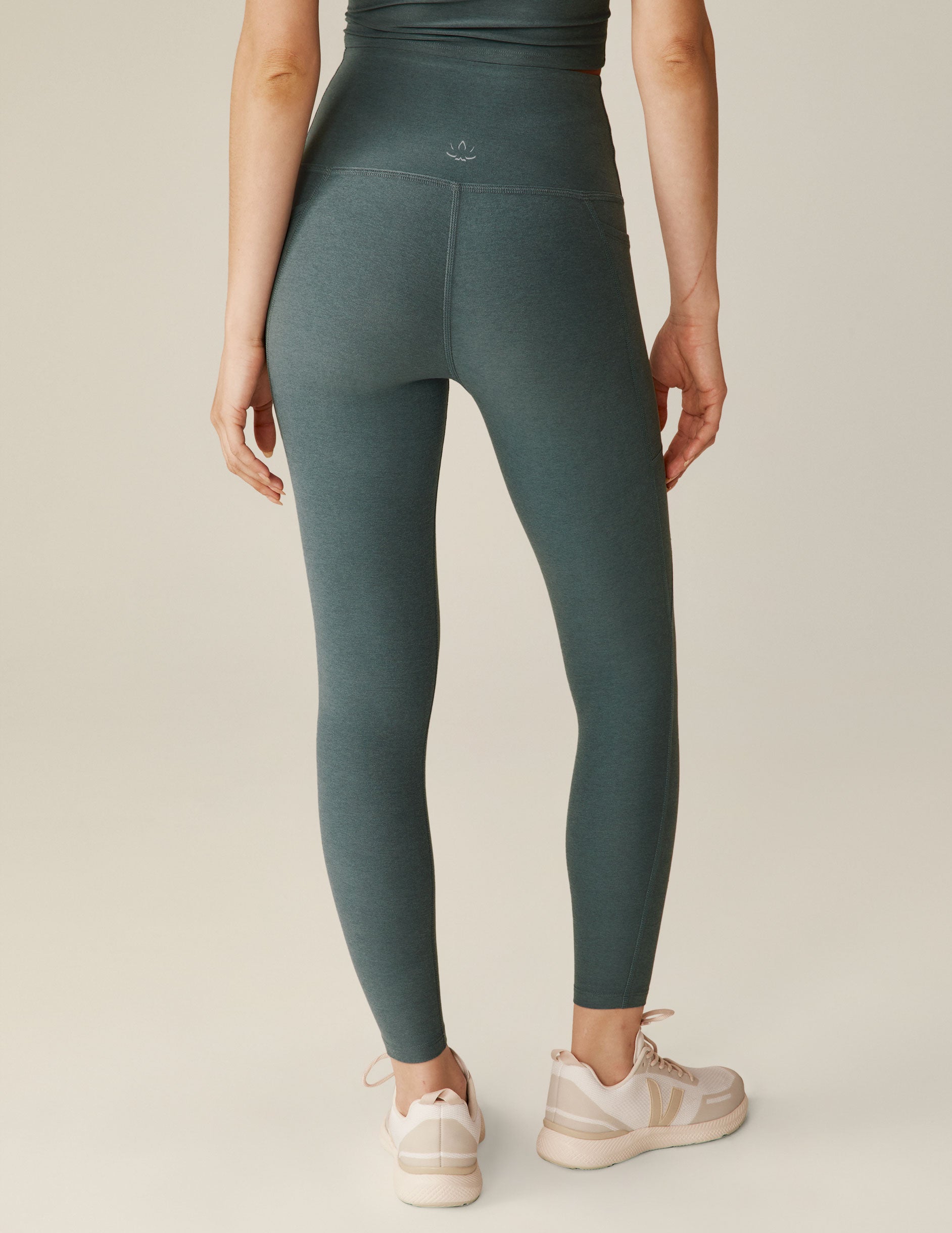 blue high-waisted midi leggings with pockets. 