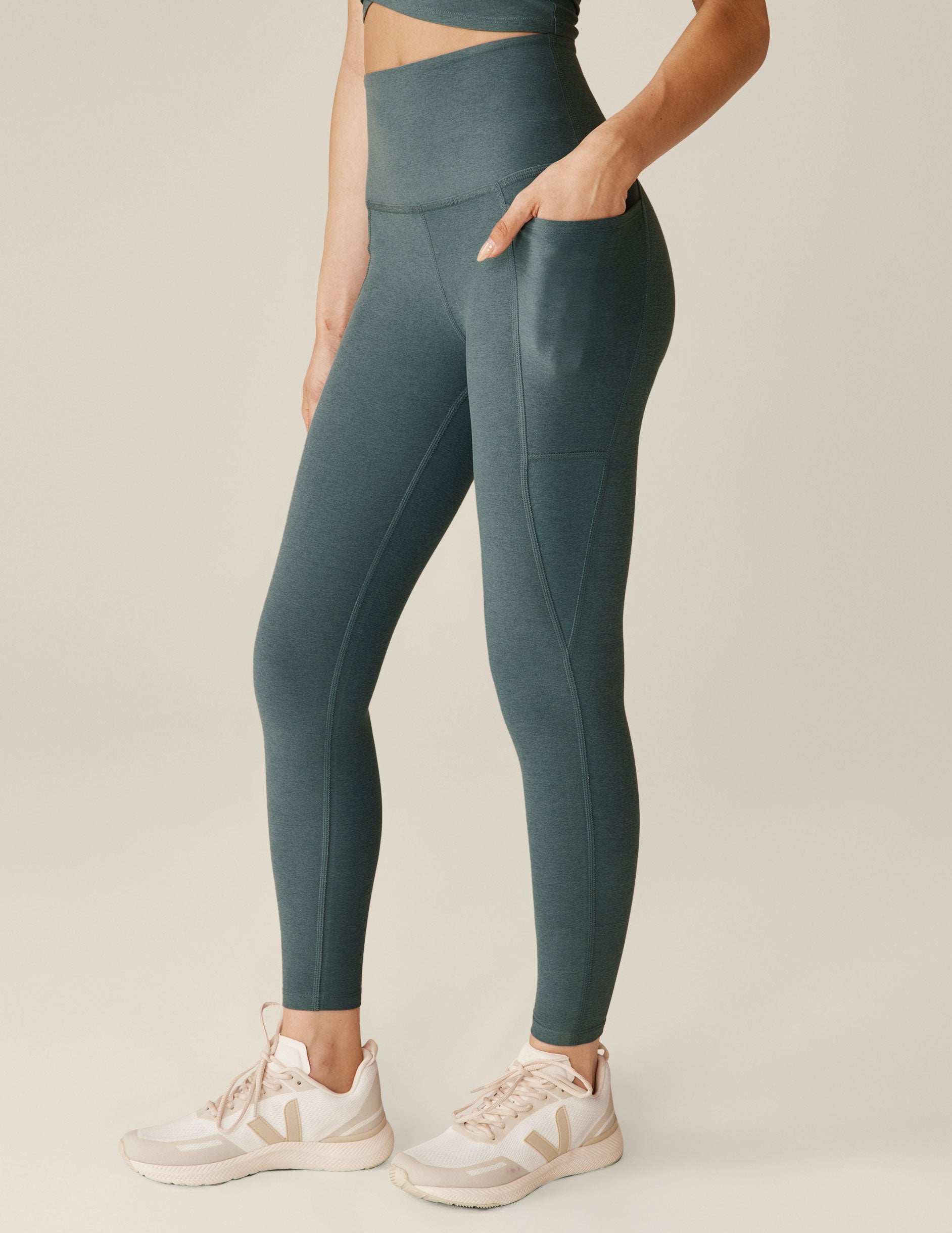 blue high-waisted midi leggings with pockets. 