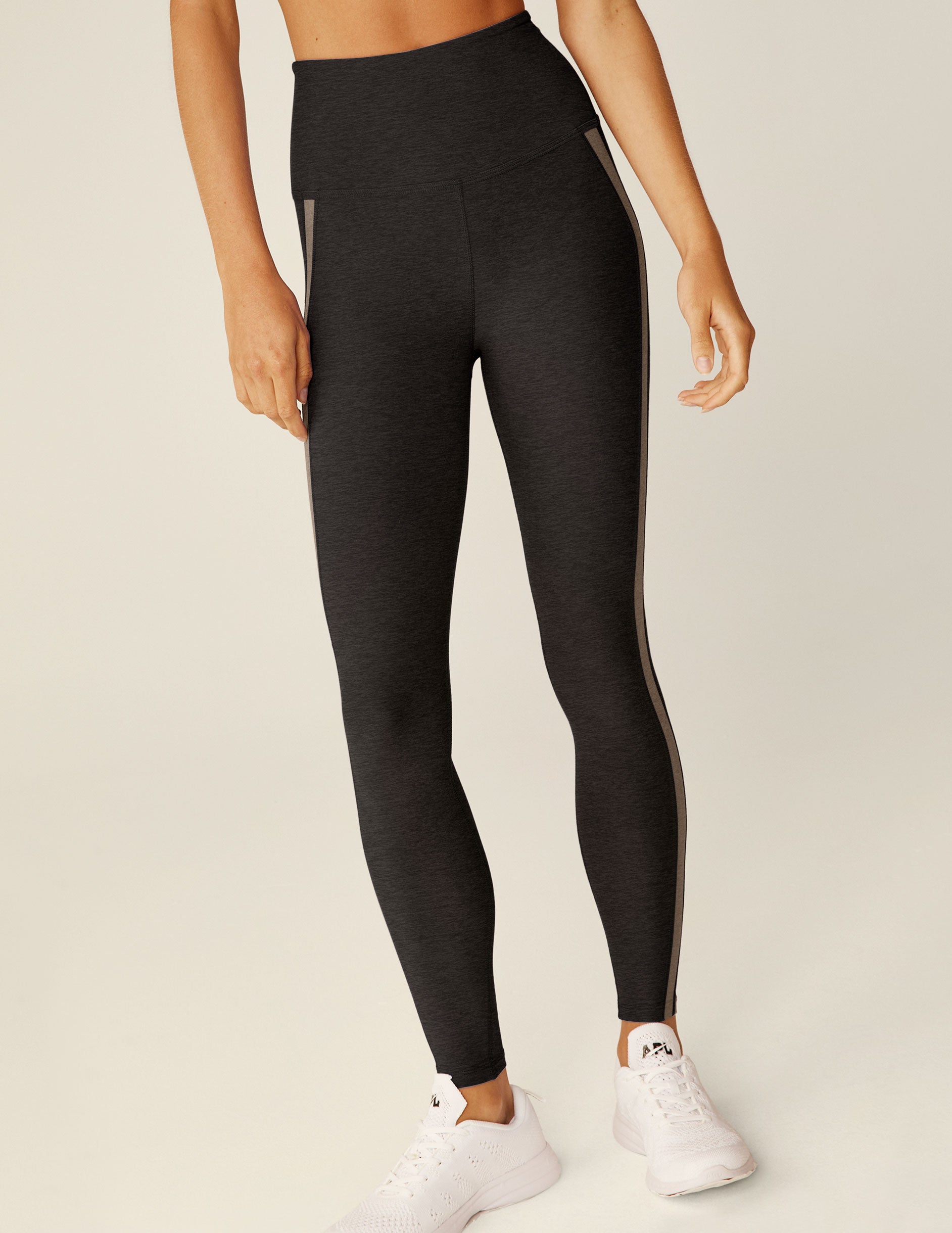 black high-waisted midi leggings with brown lining. 