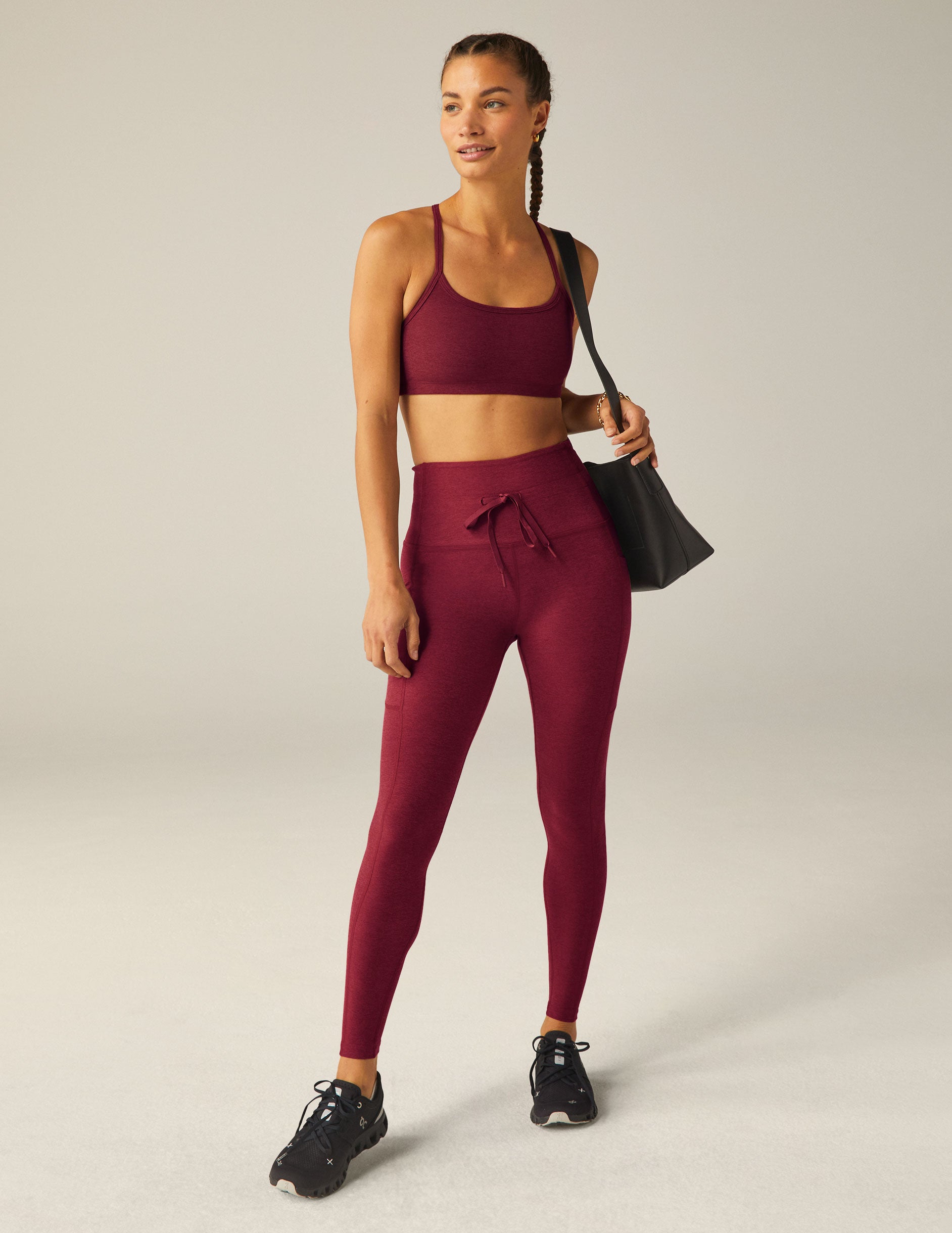 red waisted midi leggings with a drawstring at the waistband and side pockets.