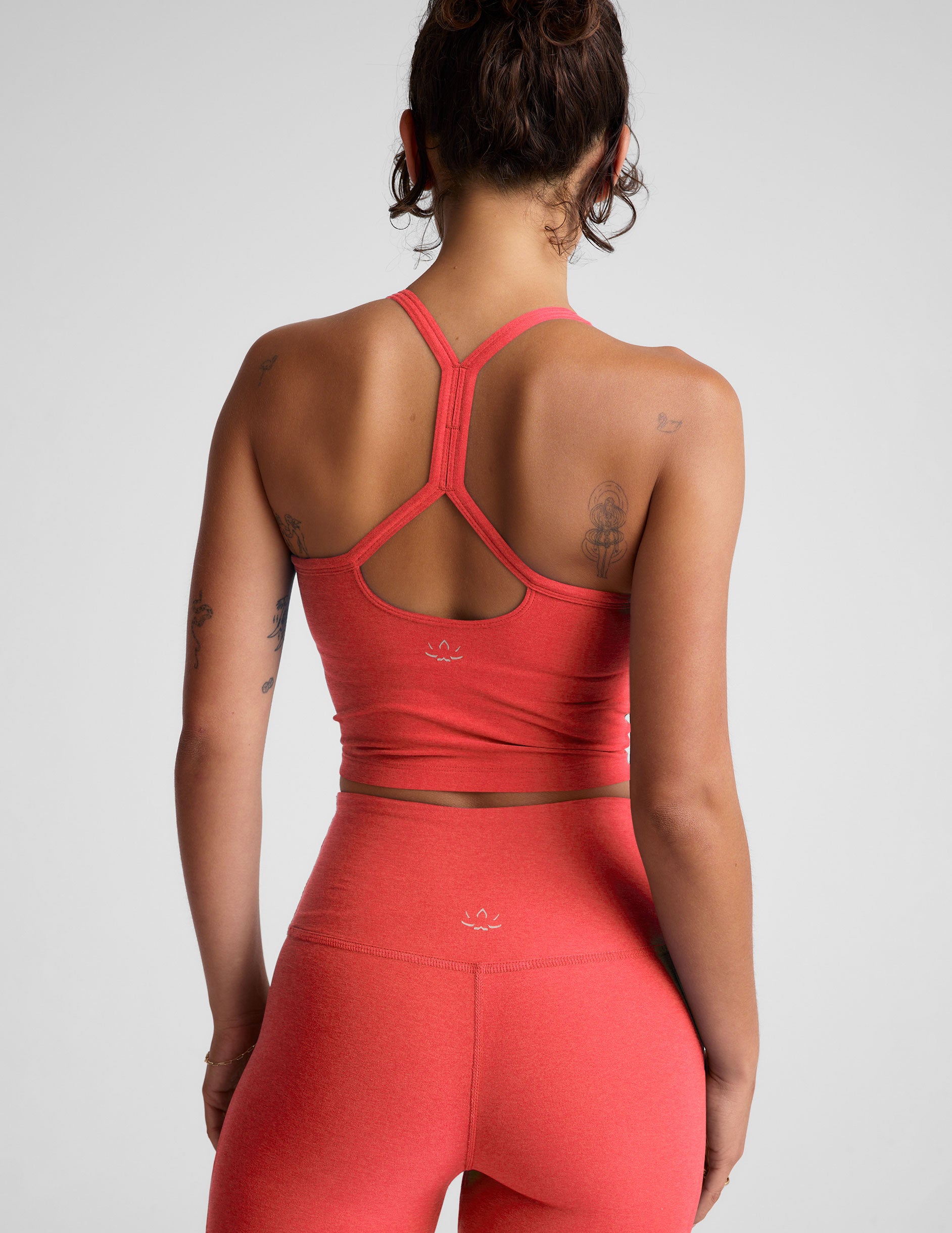 pink racerback cropped tank with slim straps.