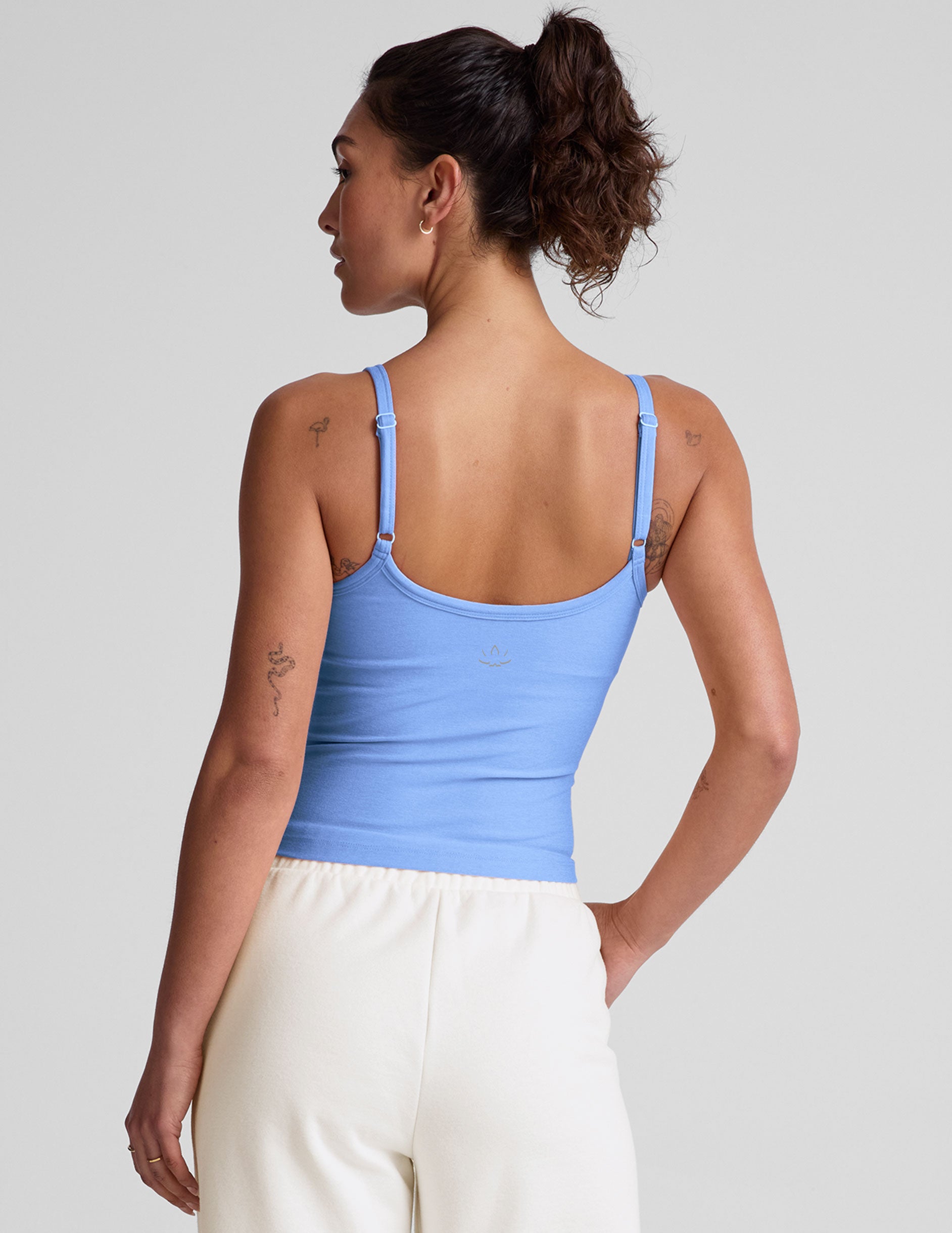 blue waist length tank top with slim adjustable straps.