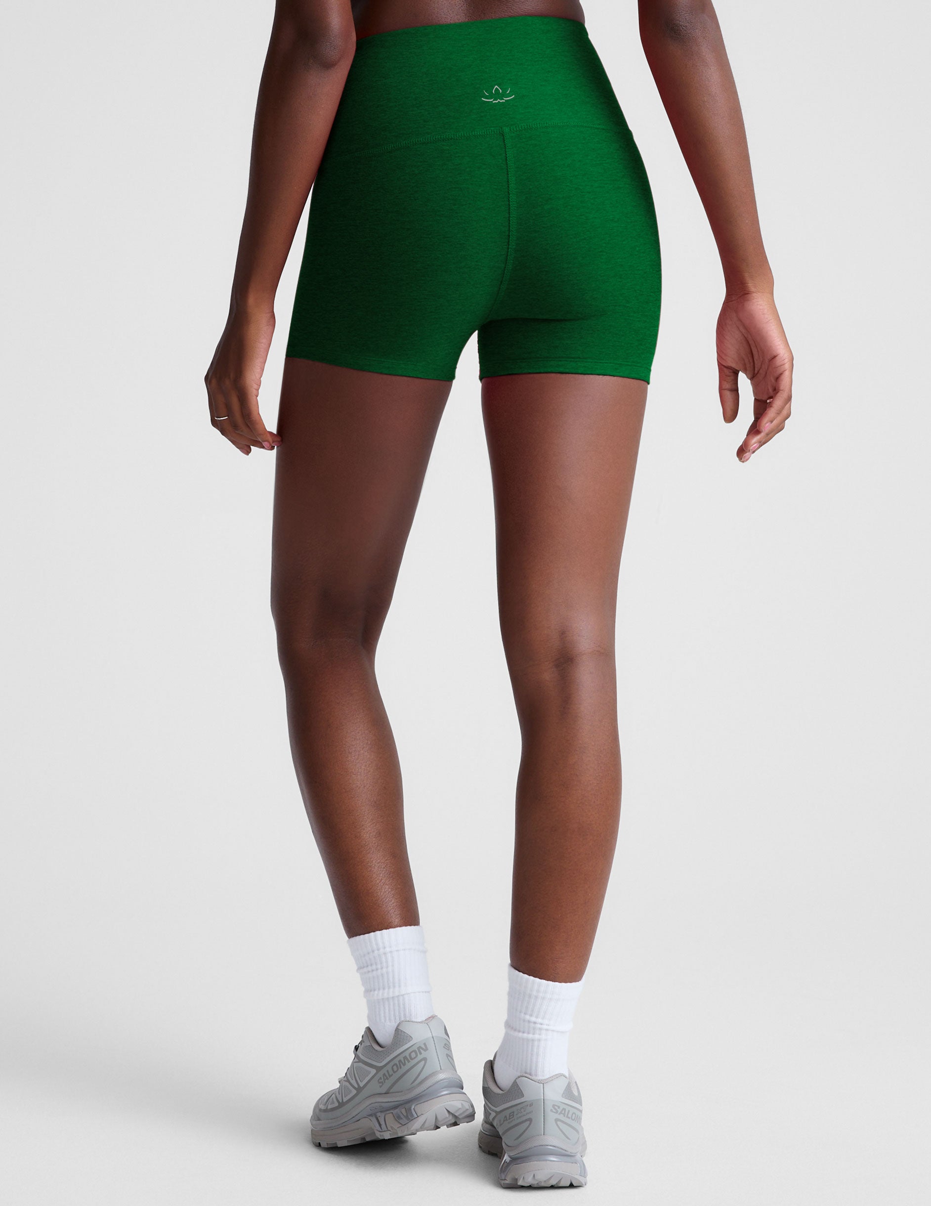green high-waisted 3" inseam biker shorts.