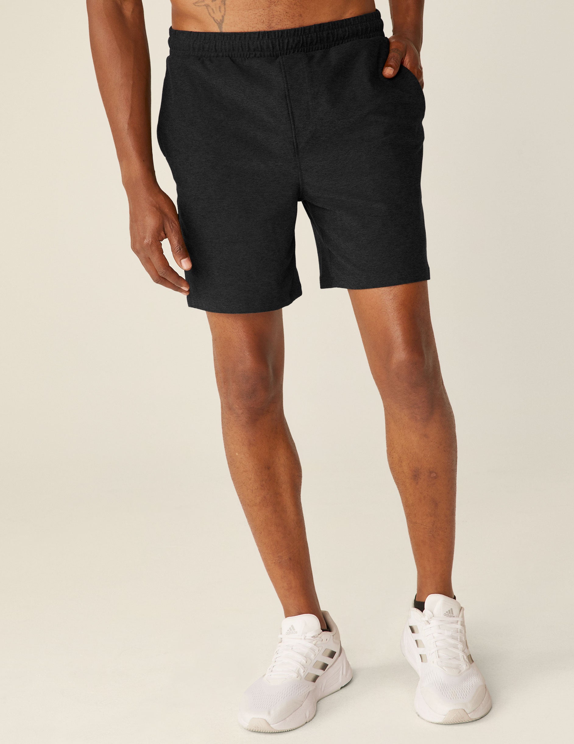 black relaxed fit men's athleisure shorts with pockets.