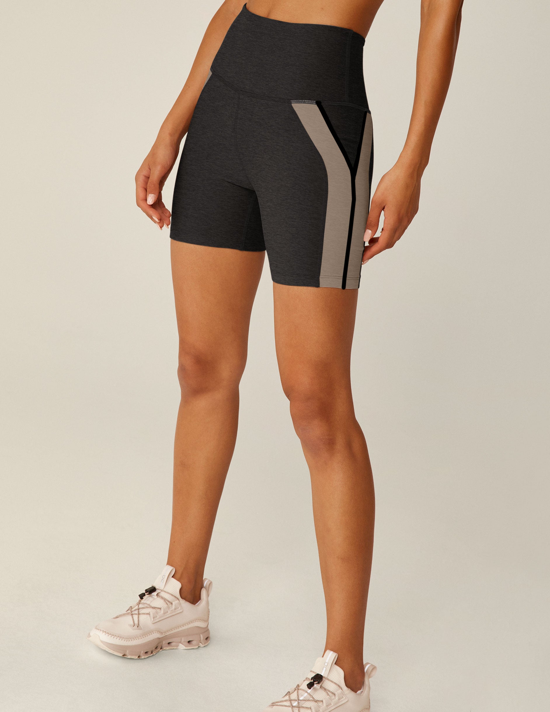 black high-waisted biker shorts with brown lining down the sides. 