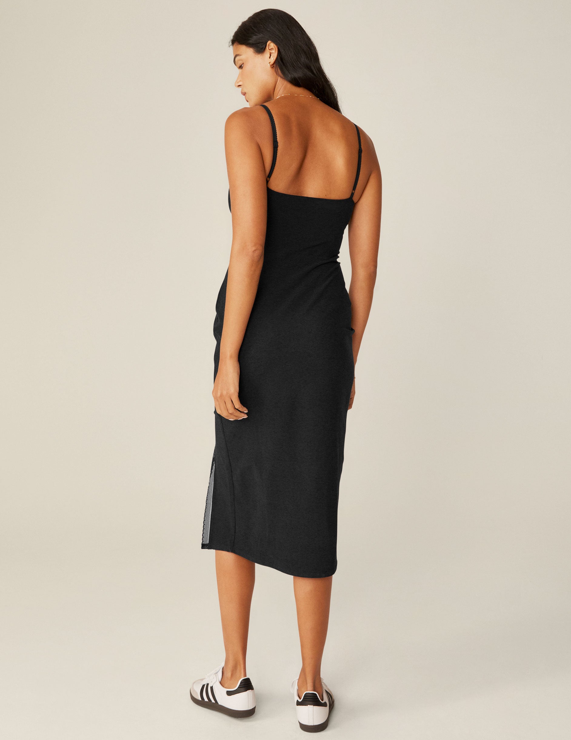 black spaghetti strap midi dress with a front side slit and lace trim.