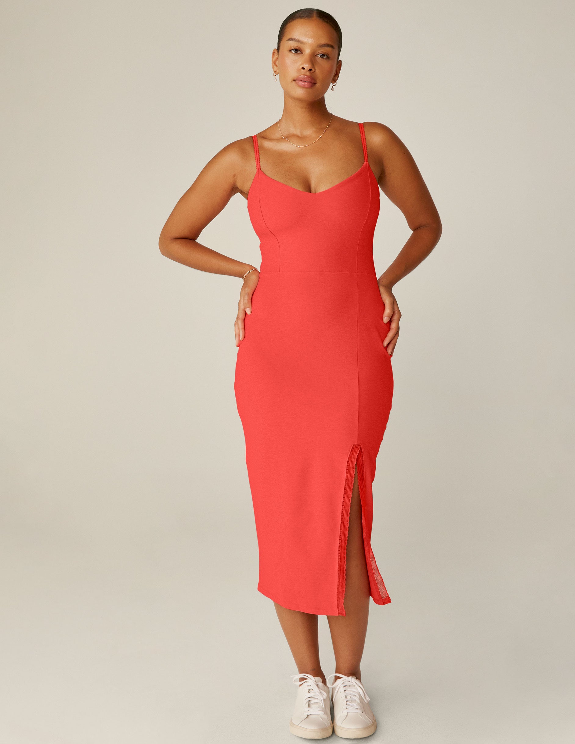 red spaghetti strap midi dress with a front side slit and lace trim. 