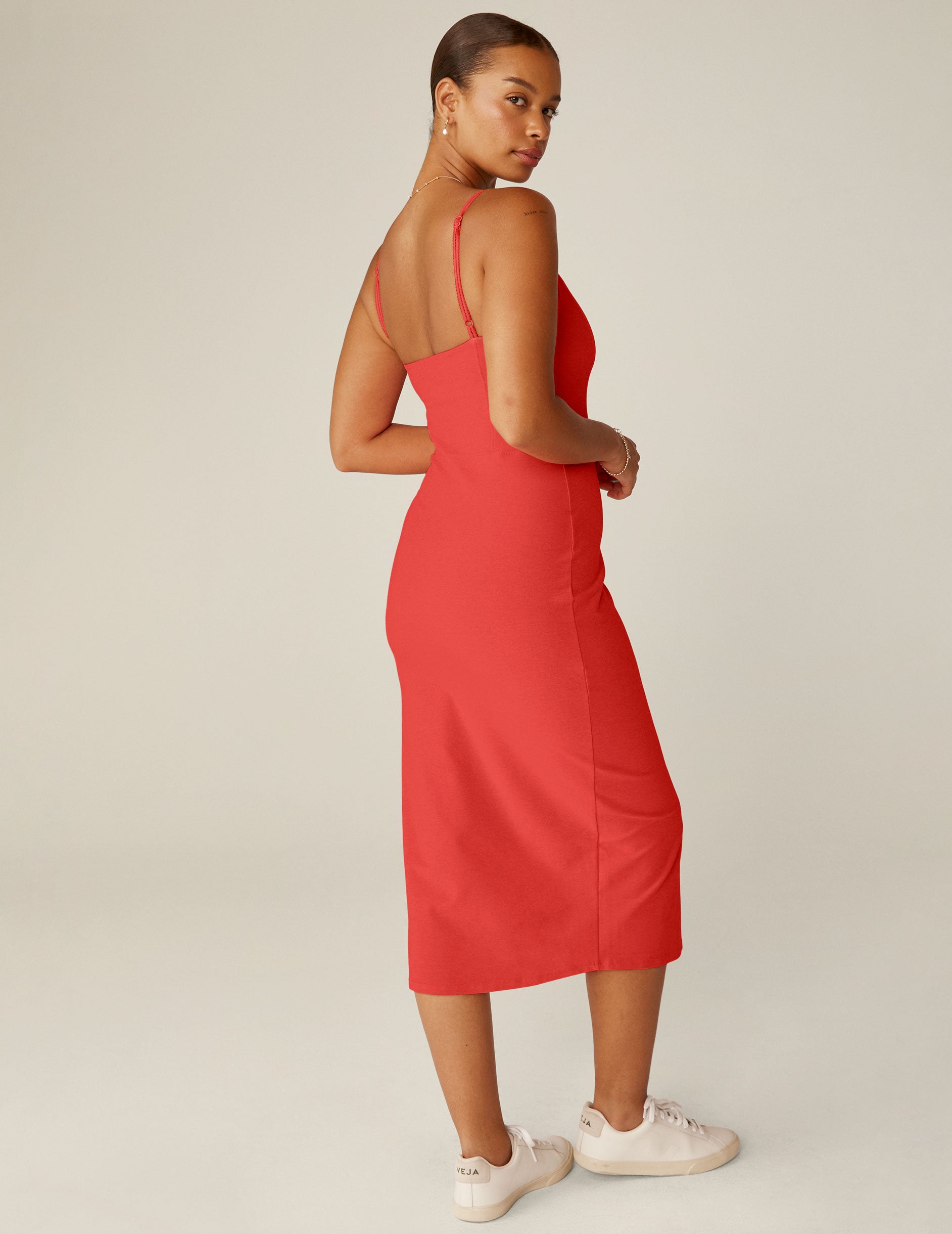 red spaghetti strap midi dress with a front side slit and lace trim. 