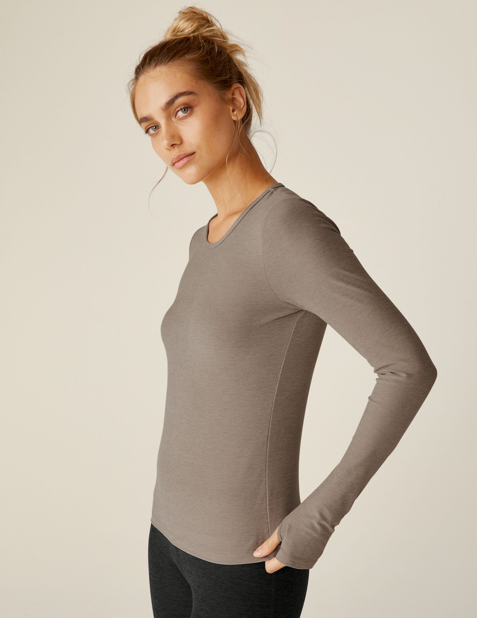 brown long sleeve scoop neck shirt with thumb holes. 