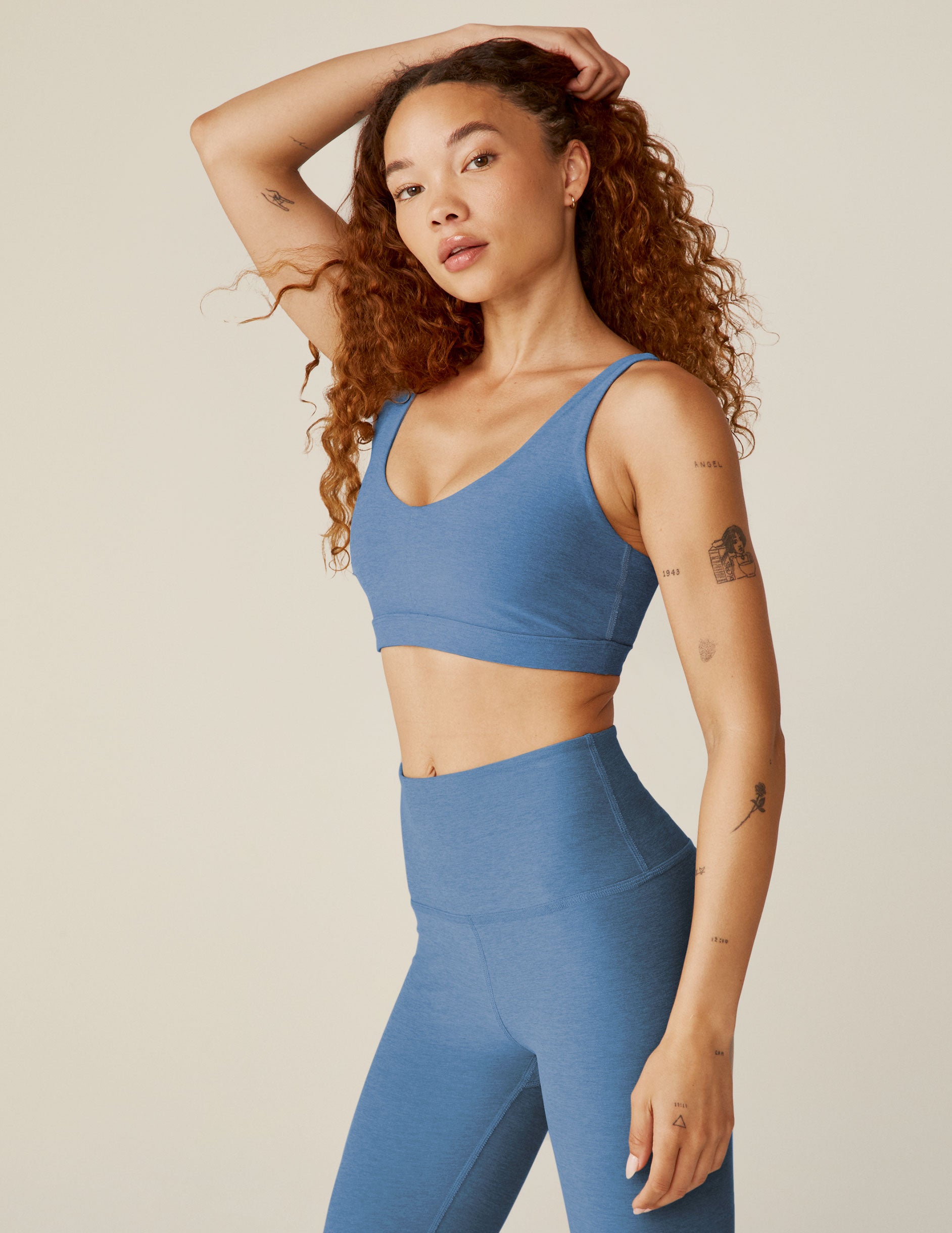 blue v-neck active bra top with adjustable straps and removeable padding. 