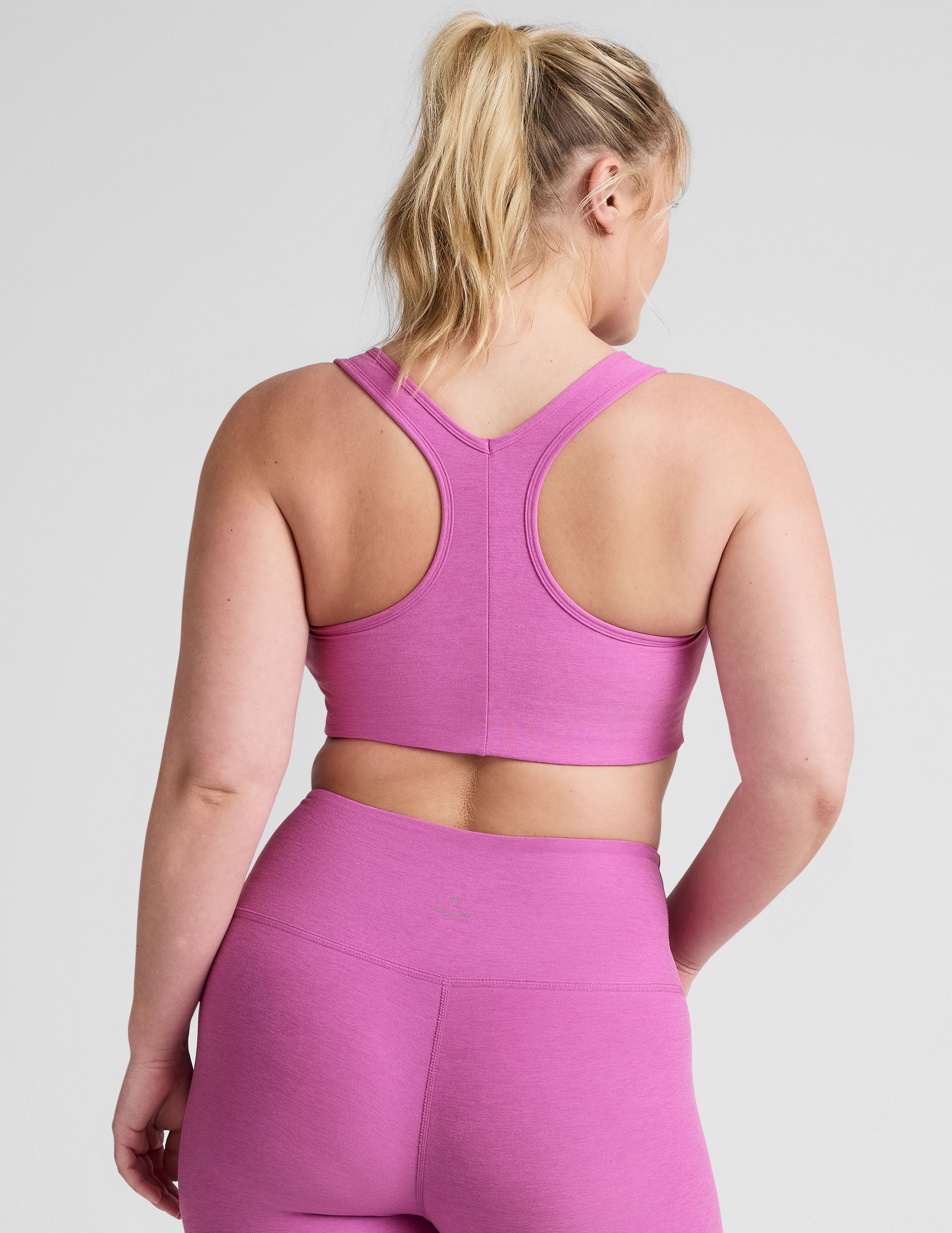pink medium support racerback bra with a 2" hemband.