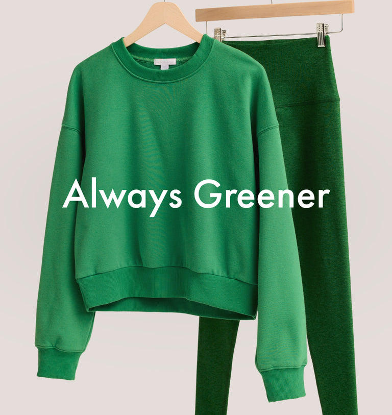 home court green crewneck sweatshirt and green high-waisted midi leggings.
