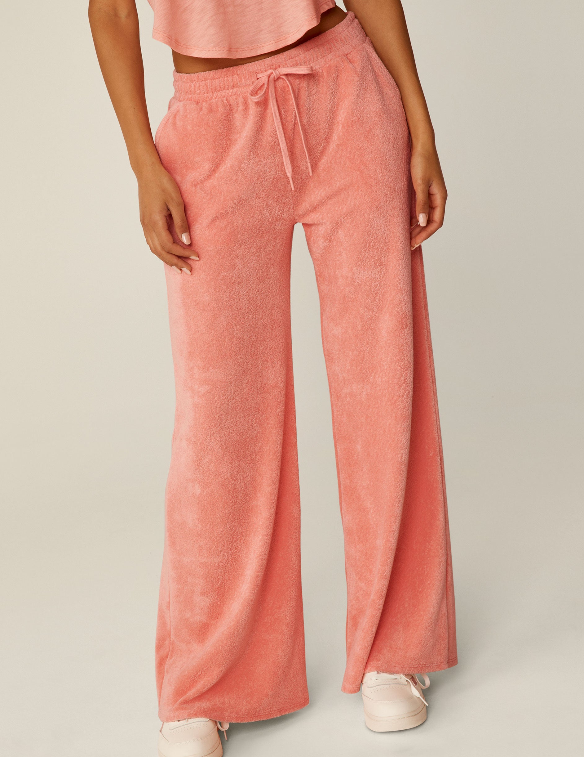 pink terry fabric pants with a drawstring at waistband.