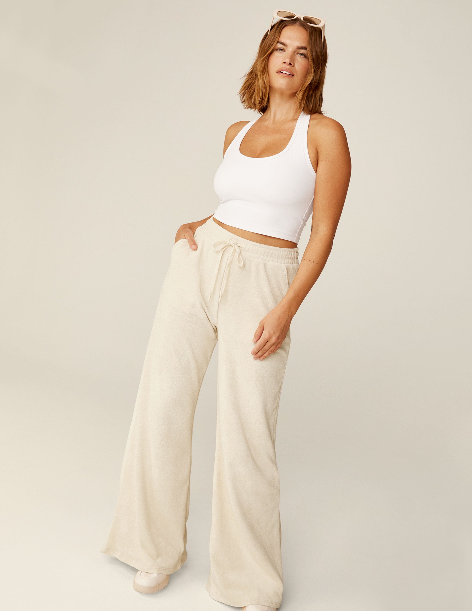 white terry fabric wide leg pants with a drawstring at the waistband.