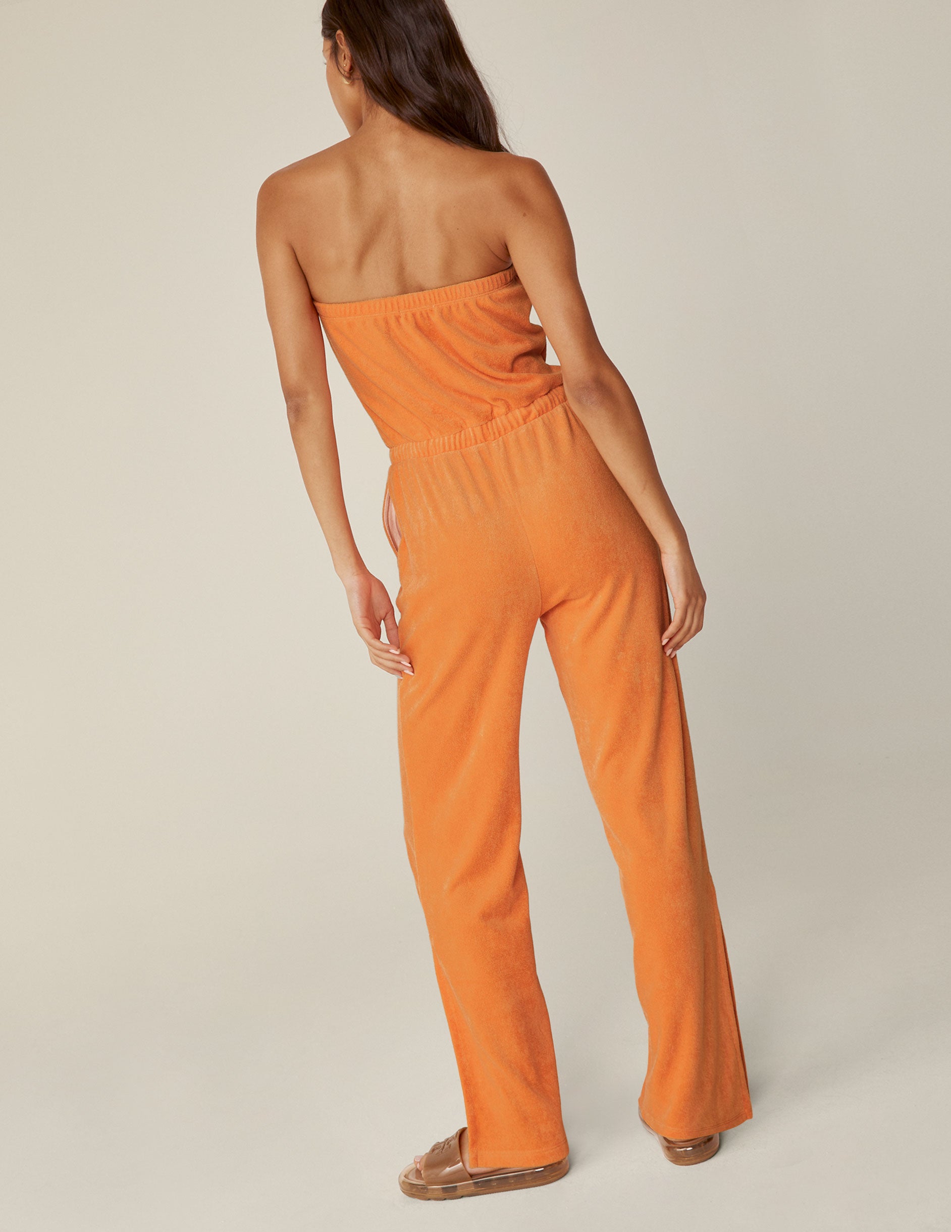 orange terry fabric jumpsuit.
