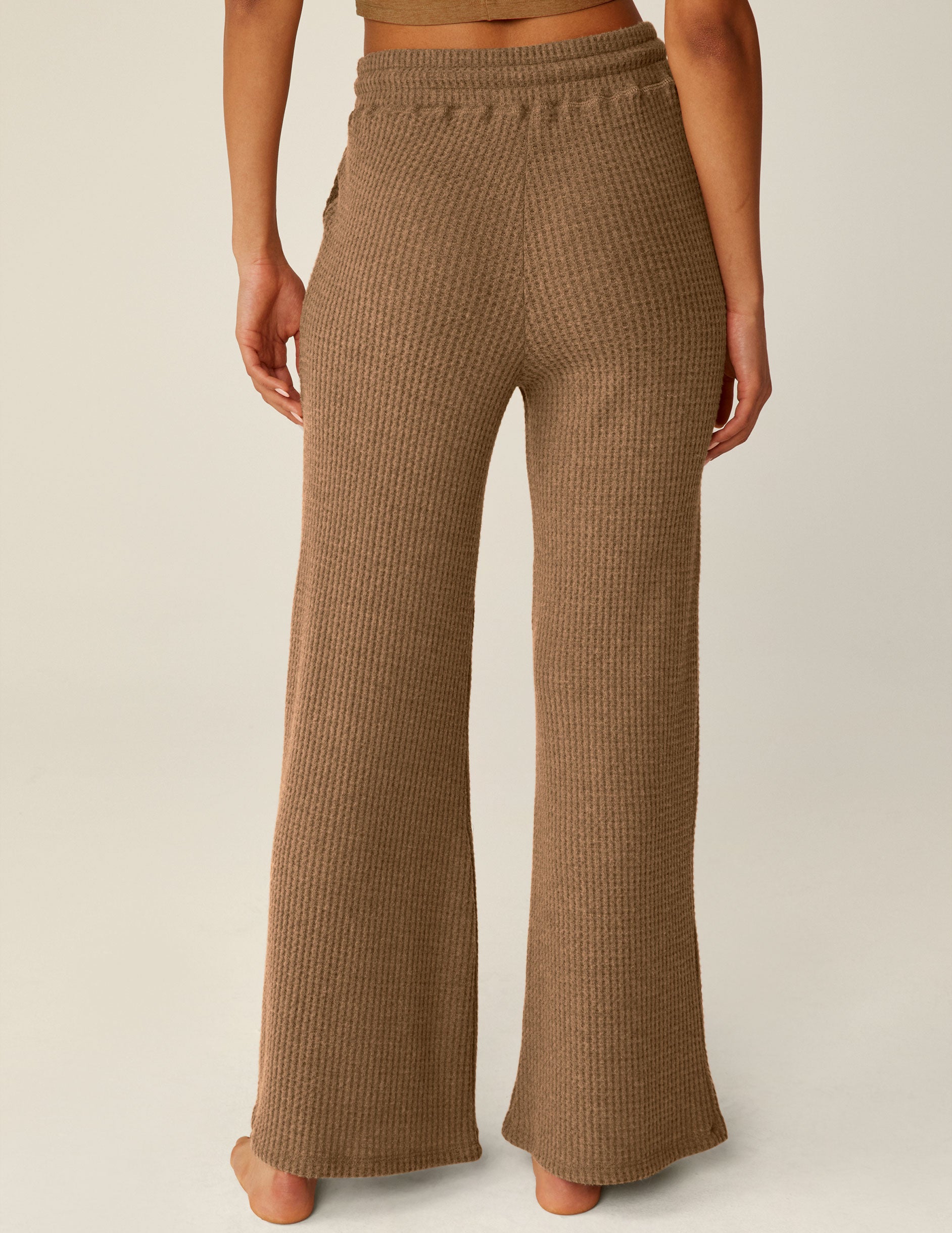 brown waffle knit pants with drawstring at waistband. 