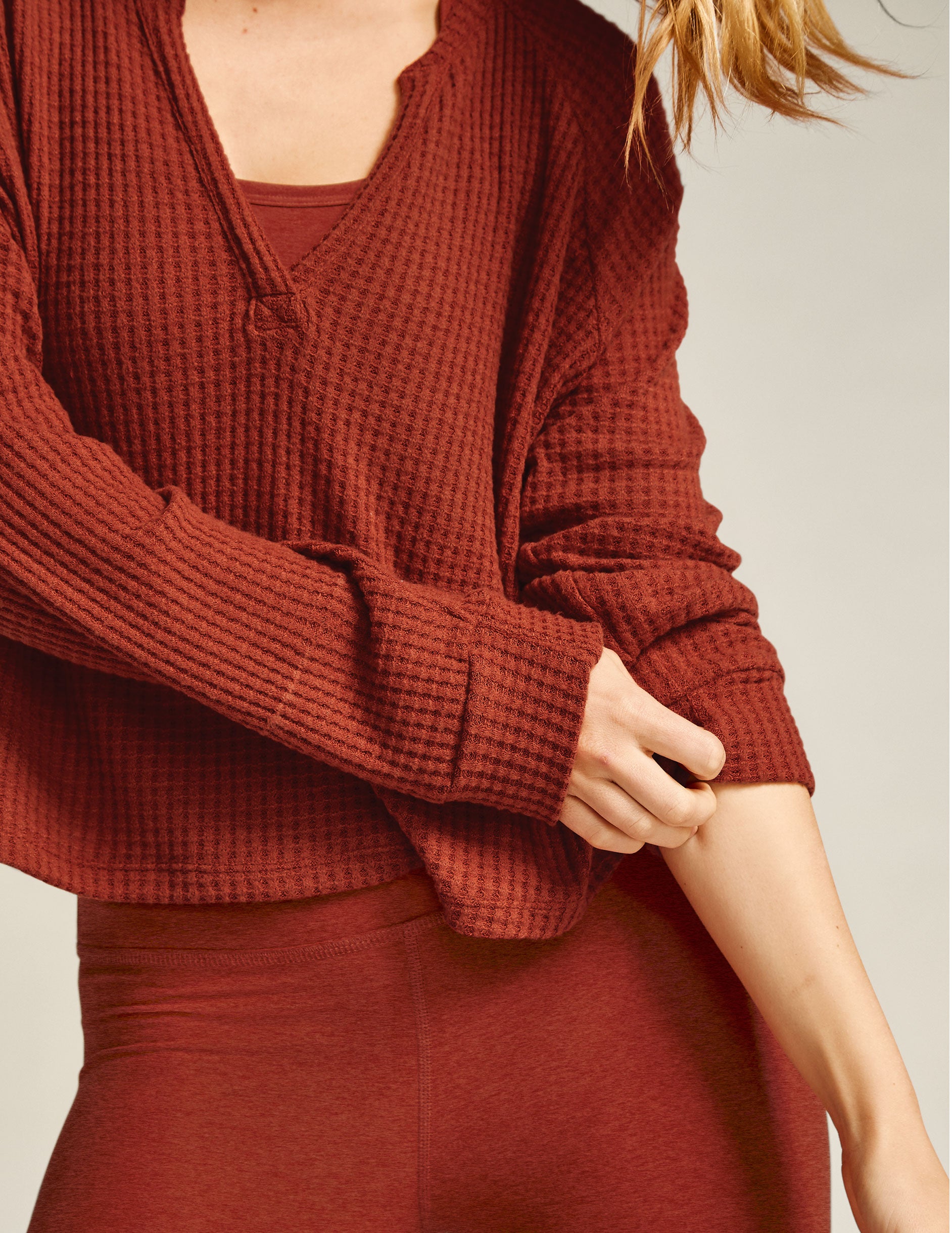 red v-neck long sleeve pullover. 