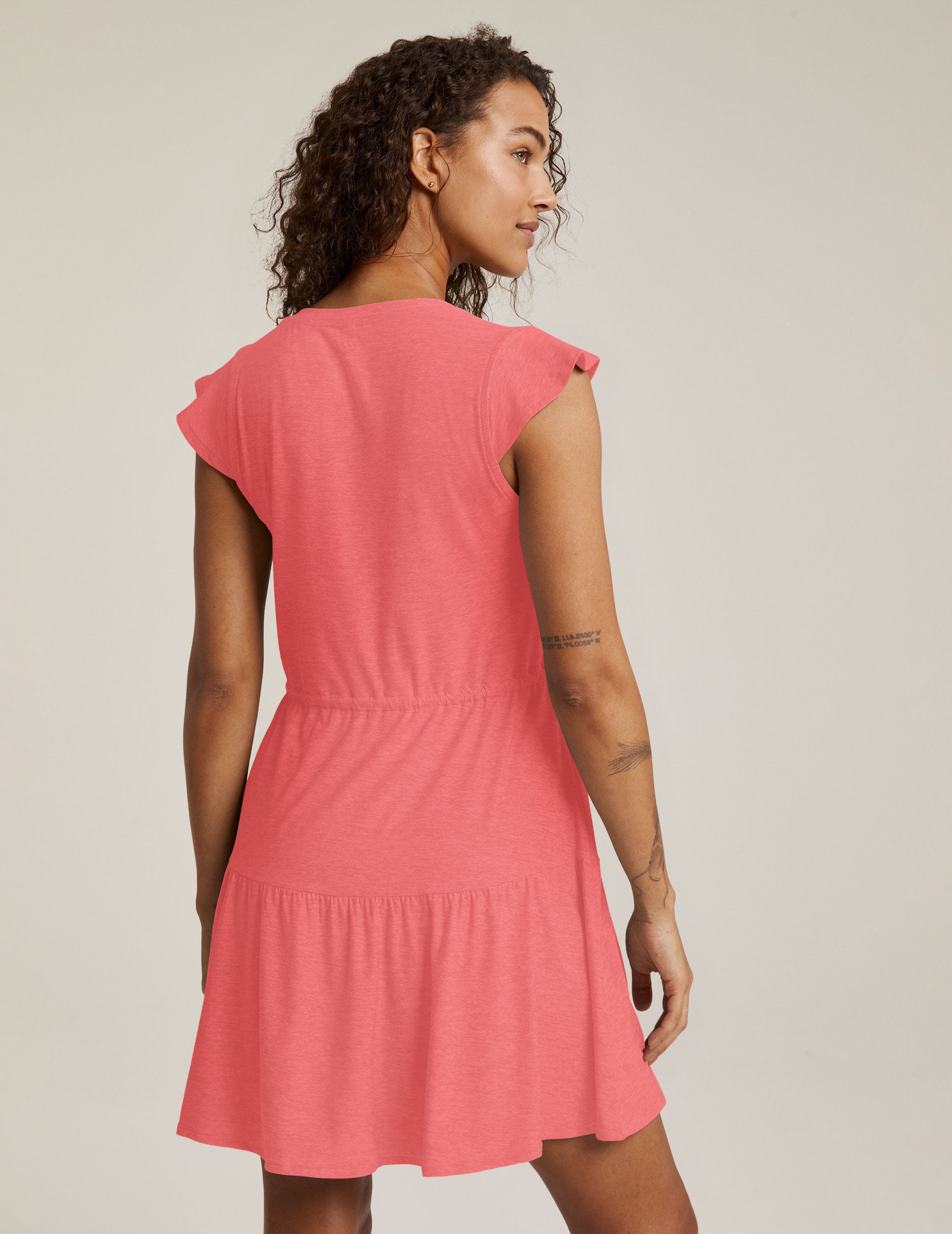 pink mini v-neck ruffle dress with drawstring detail at waist