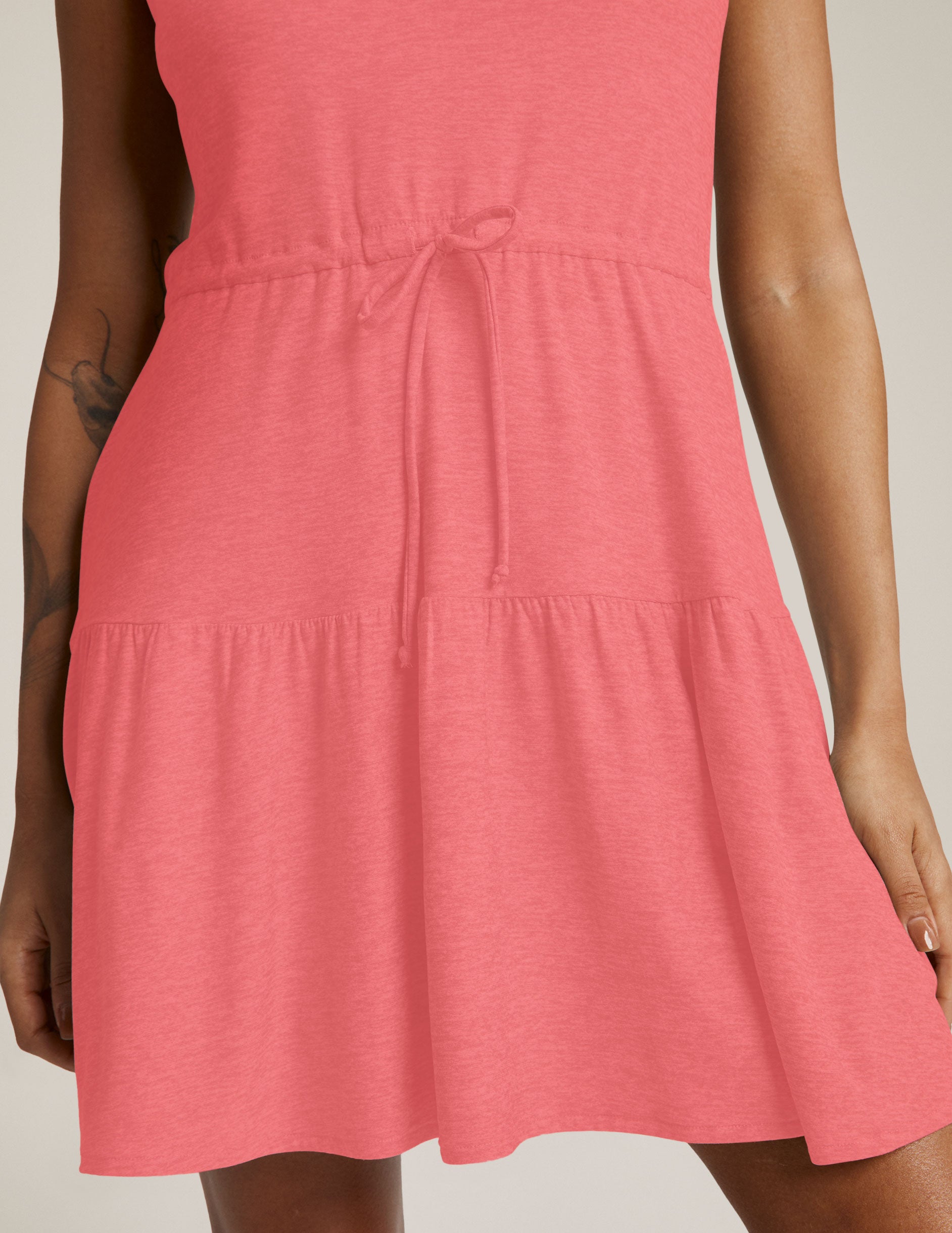pink mini v-neck ruffle dress with drawstring detail at waist