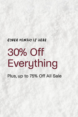 Promotional text for Cyber Monday sale on a textured white background. 