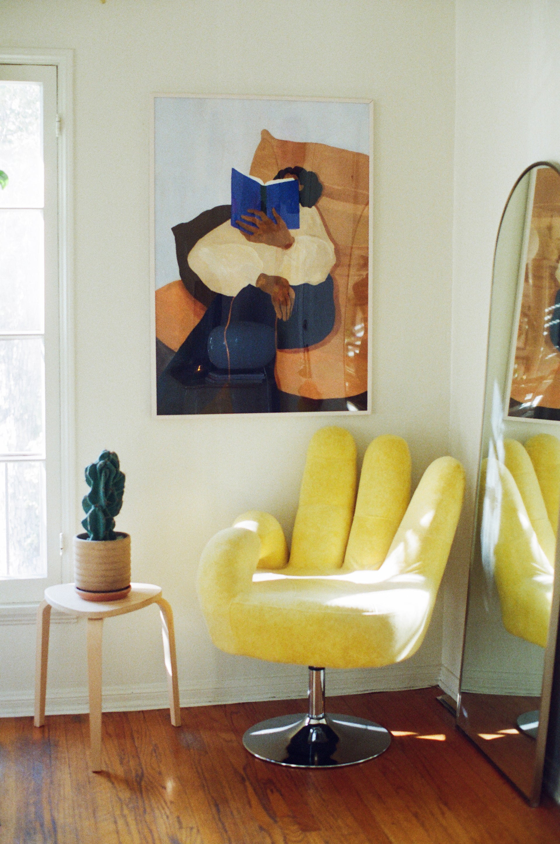 Photo of yellow chair shaped like a hand