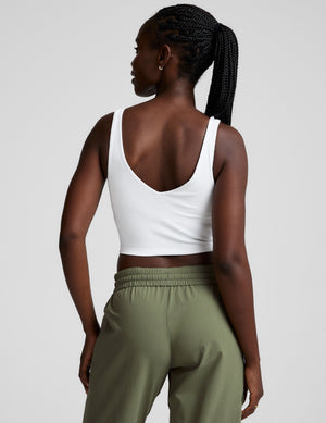 white ribbed cropped tank with a front and back soft v neckline. 