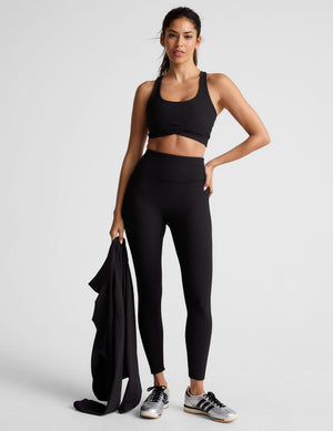 black ribbed racerback bra with overlapping hemband detail​ and a scoop neckline. 