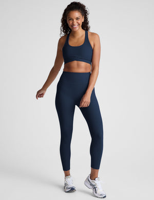 blue racerback bra with a scoop neckline​
and overlapping hemband detail​. 