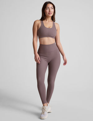 brown medium support racerback bra with a scoop neckline​, overlapping hemband detail​, is lined with performance lining and powermesh in between​, and has removable bra pads​. 