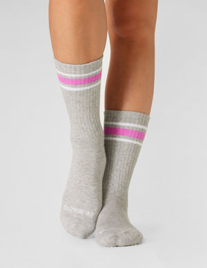 gray crew socks with pink stripe detailing. 