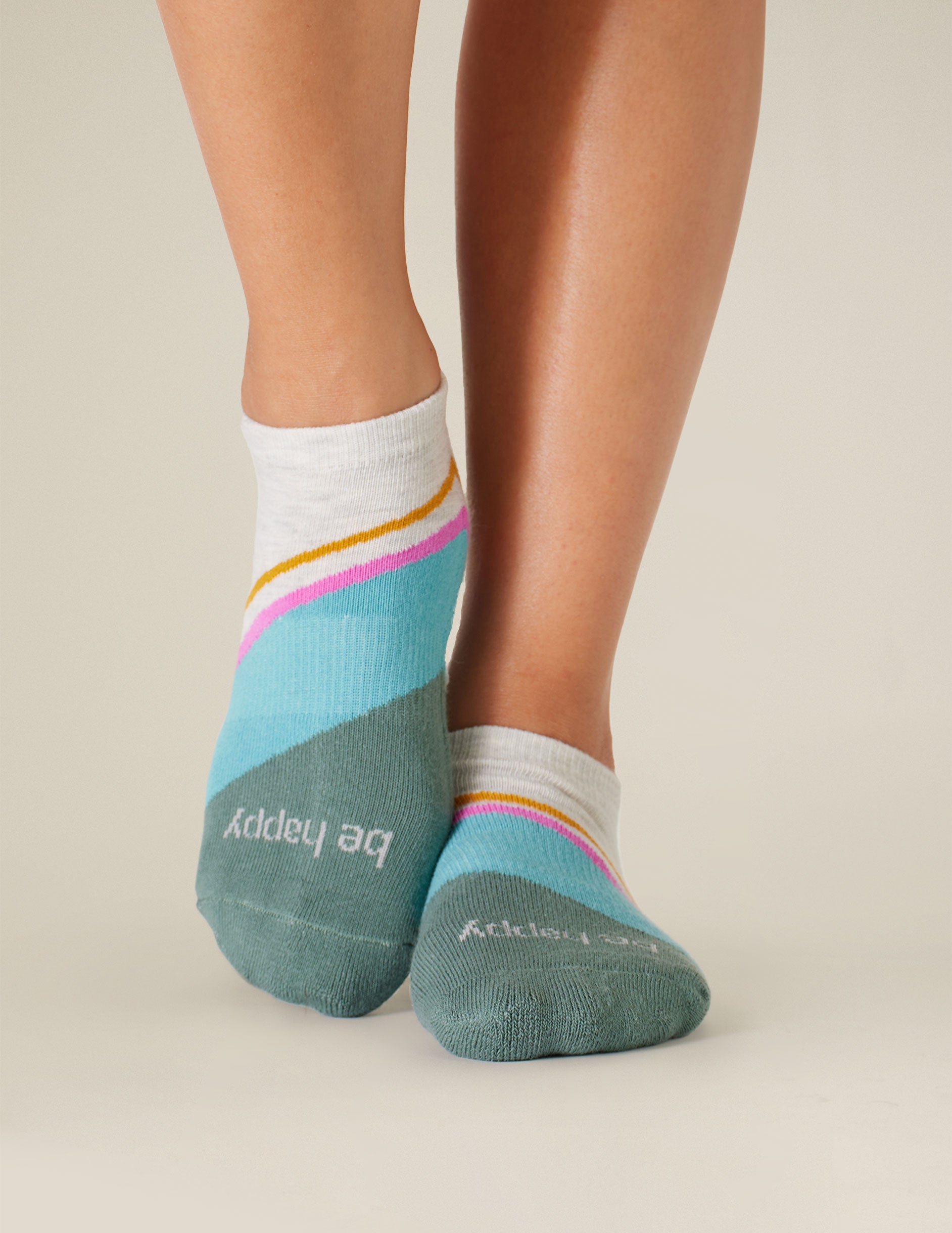 blue, white, pink, and orange ankle grip socks. 