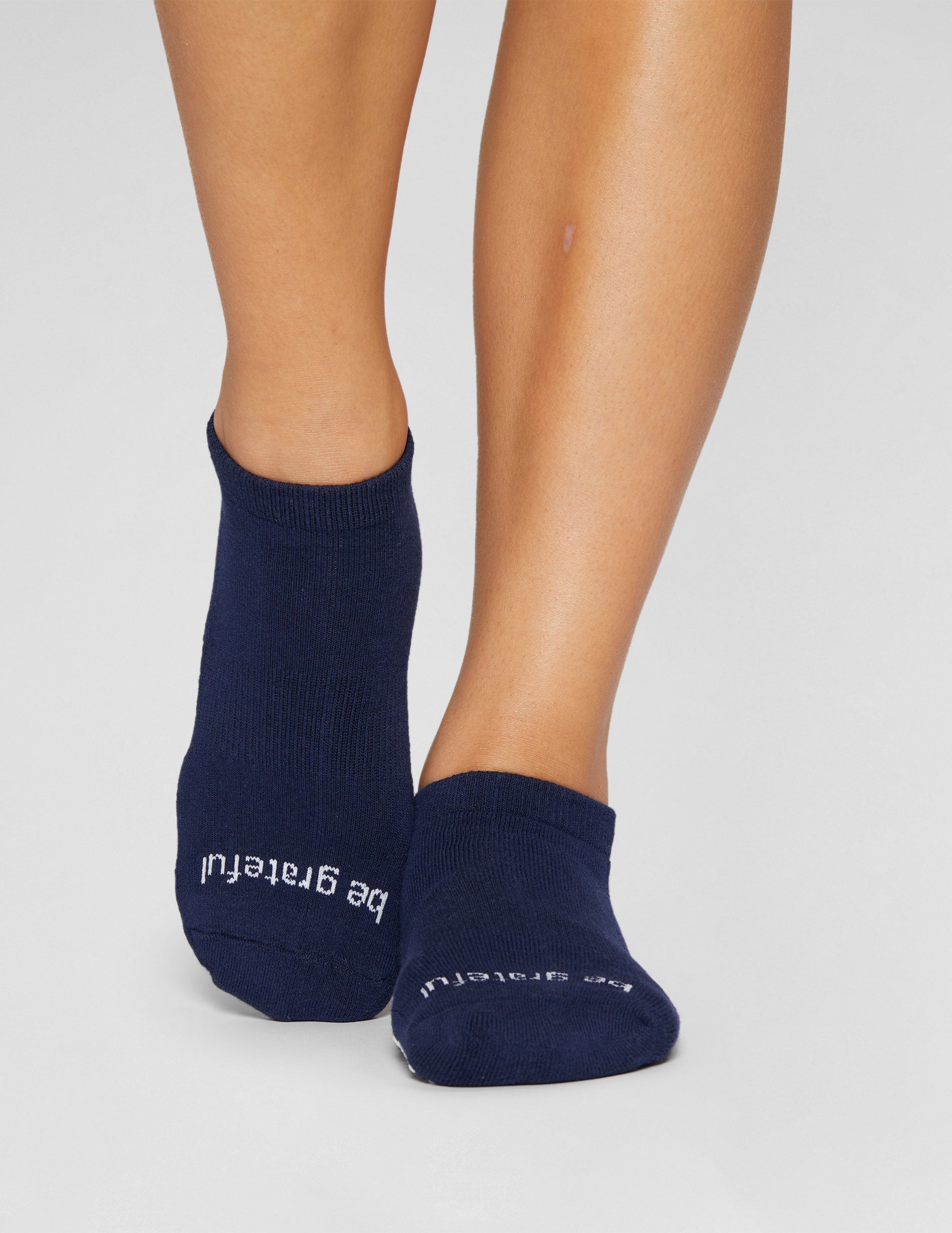 blue ankle length grip socks. 